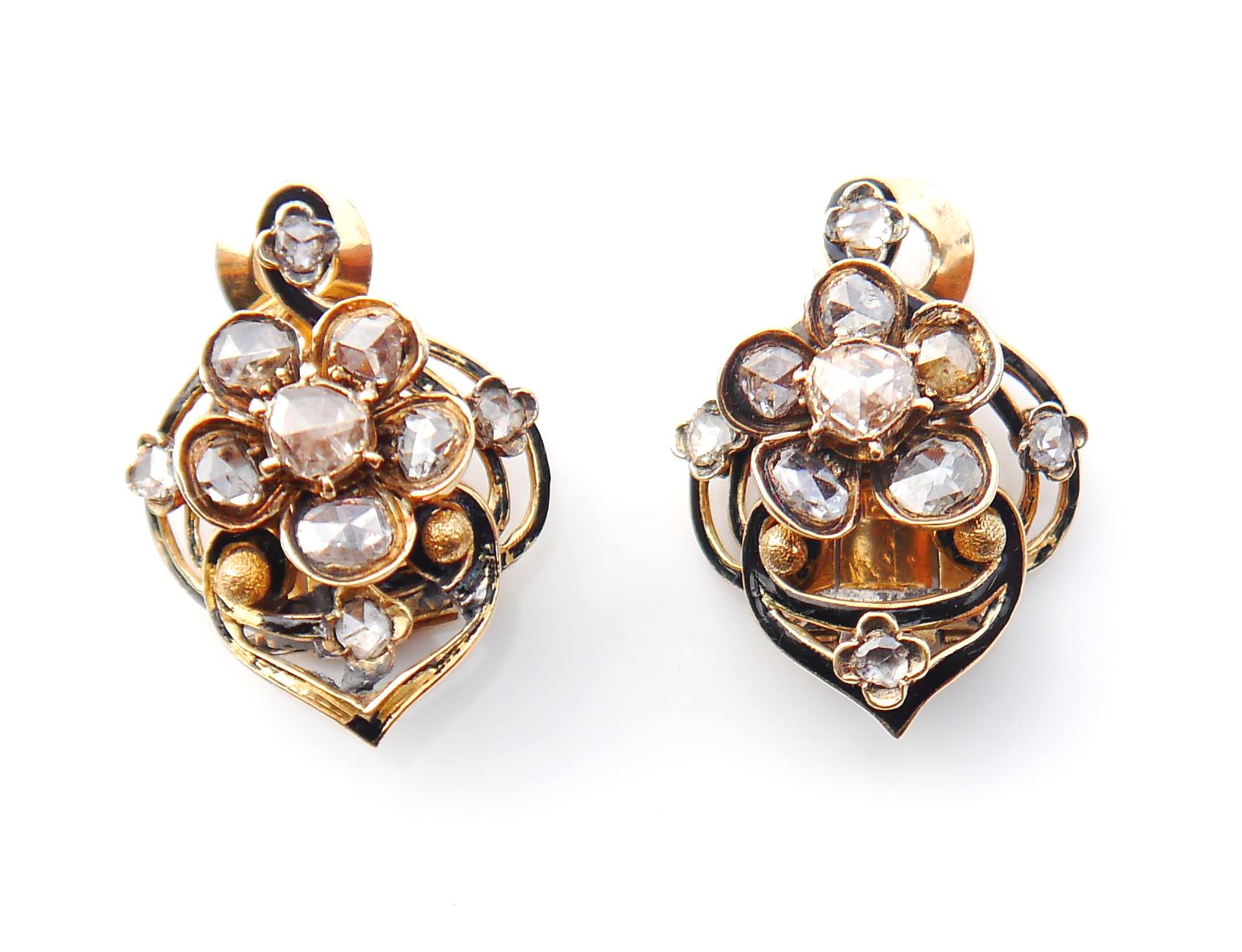 A pair of Vintage Egyptian handmade Diamond Huggies or Clips in 18 Yellow Gold. Openwork shields with flowers connected, with borders in Black Enamel. One diamond flower can be rotated around.

Folding locks. Egyptian hallmarks for 18K. Circa 1920 -