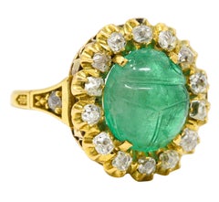 Vintage Egyptian Revival 7.80 Carats Carved Emerald Diamond 18 Karat Ring