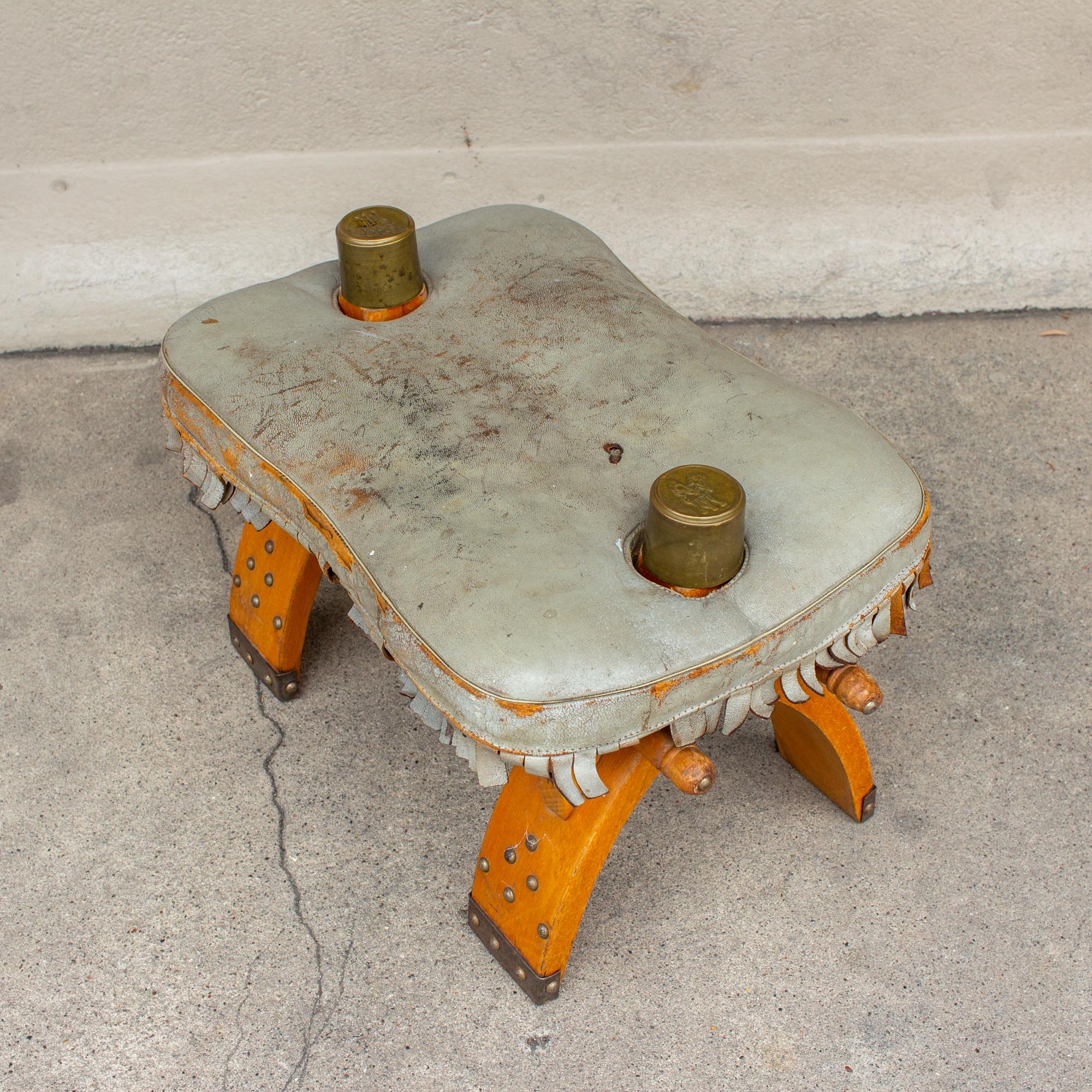Vintage Egyptian Wood Camel Saddle Foot Stool w/ Leather Cushion & Brass Detail In Distressed Condition In Houston, TX