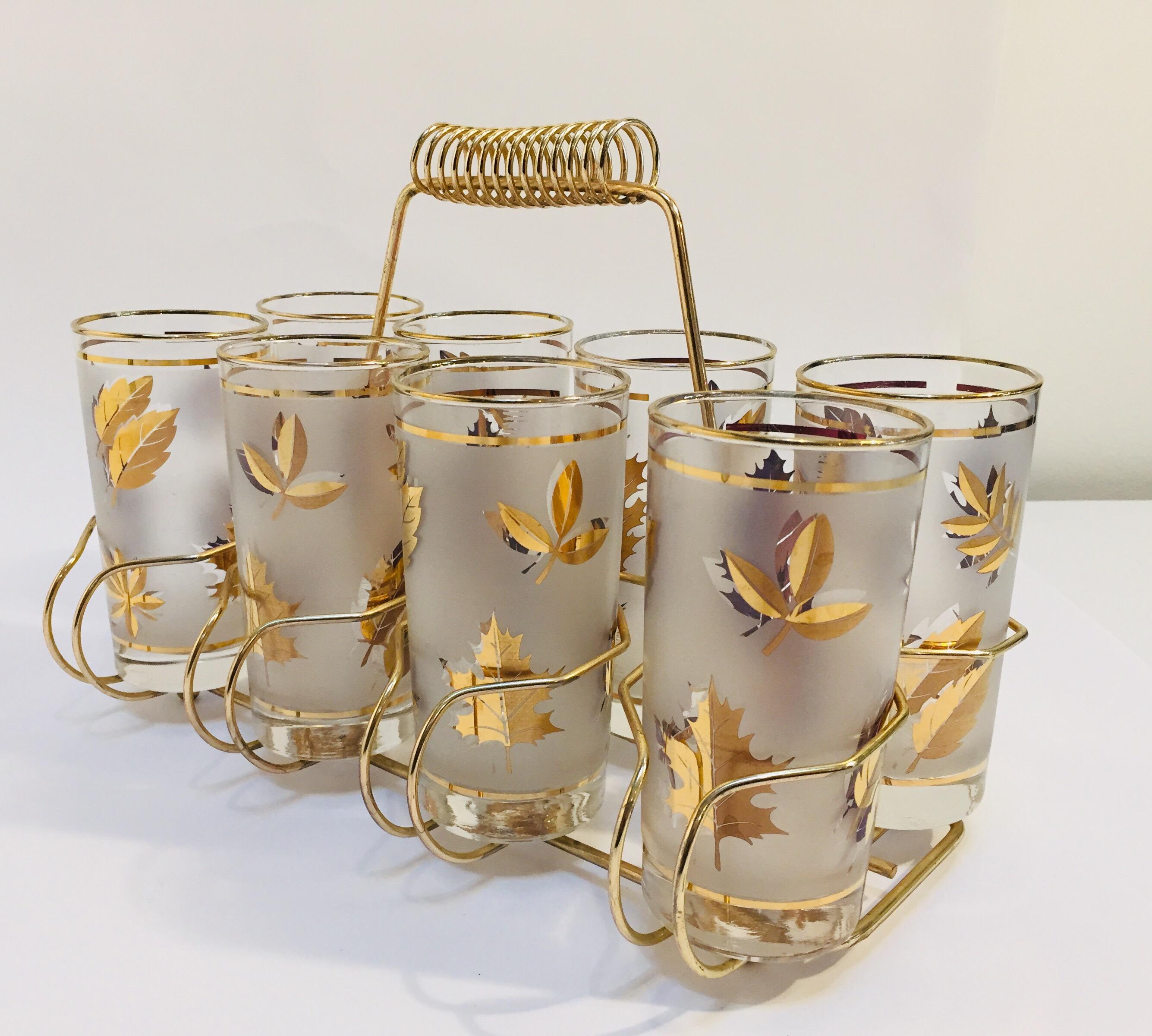 Elegant exquisite vintage set of eight Collins glasses designed by Fred Press.
Set includes eight highball glasses in a polished brass cart with handle.
The glasses are decorated with gold and black.
Perfect vintage condition, with 22-karat gold