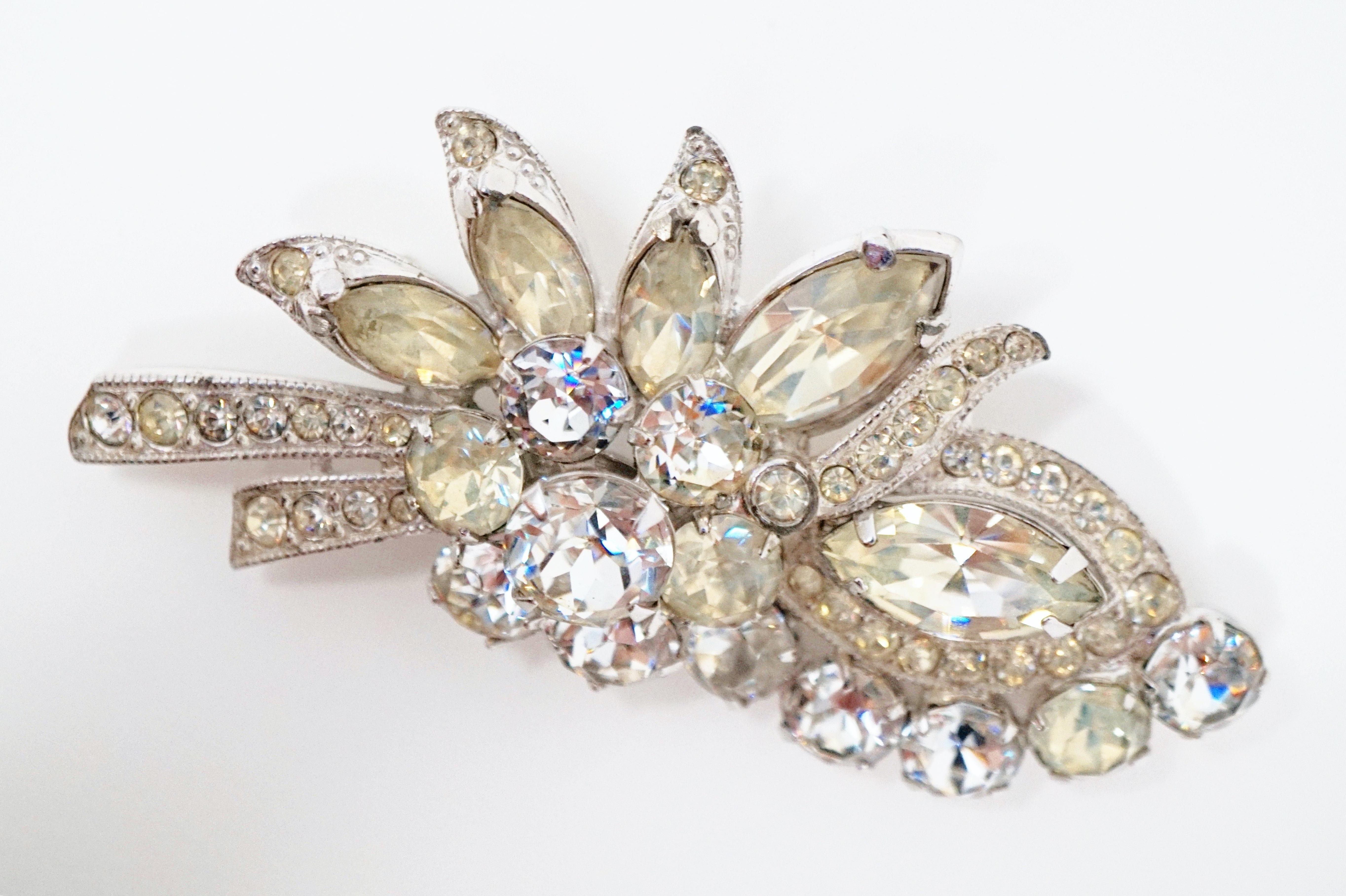 This vintage crystal rhinestone brooch by iconic costume jewelry brand Eisenberg, circa 1940s, is the perfect way to add a touch of sparkle to your look! Eisenberg's line of 