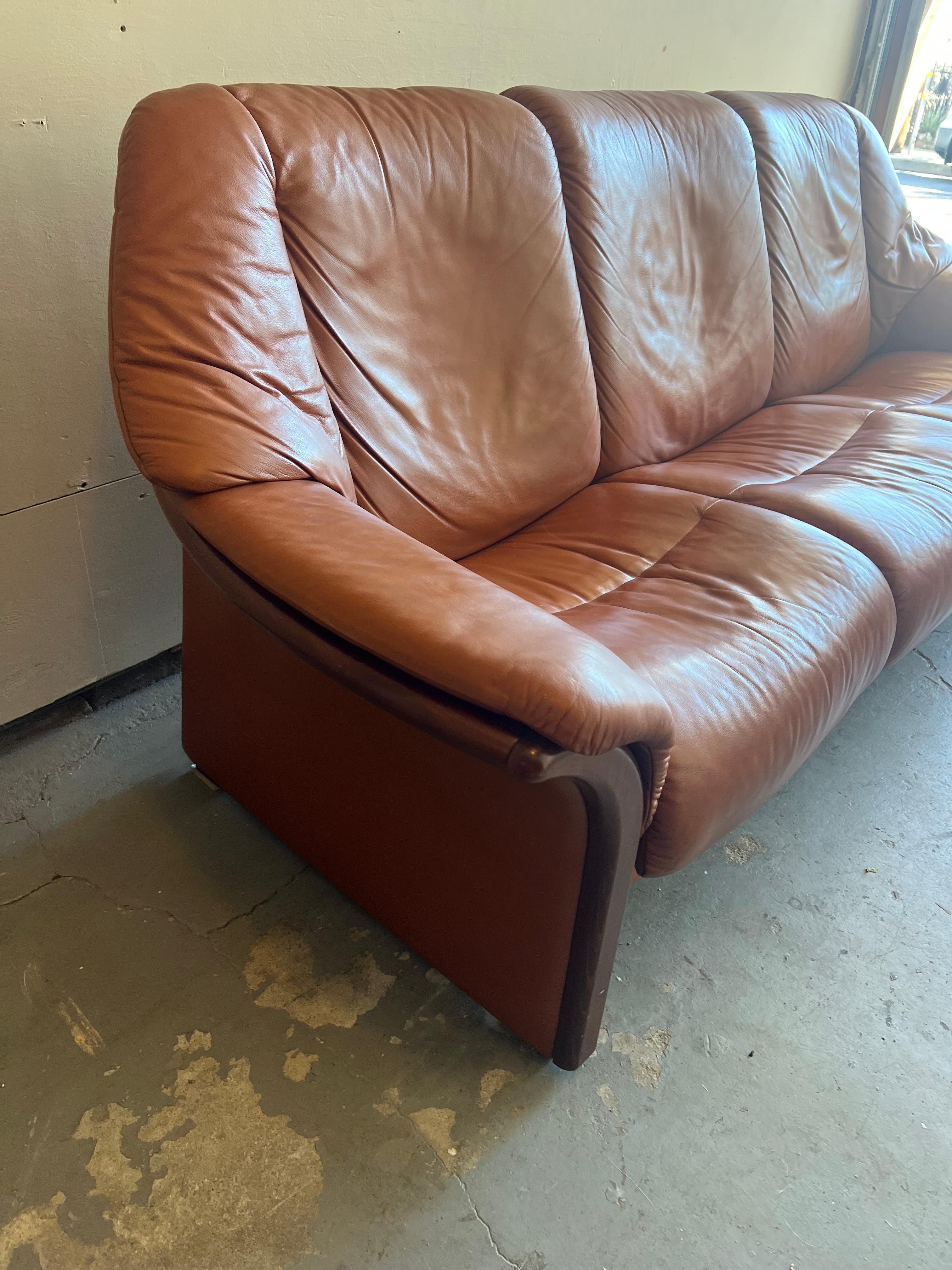 Beautiful, burnt caramel leather EKORNES stressless three seater sofa. Buttery soft leather, worn in to perfection and with the perfect patina. The vintage “eldorado” style that is no longer in production. A more rare style. Kept in excellent