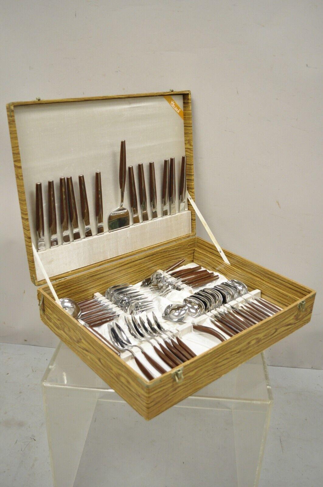 Vintage Eldan Japan ELD 2 brown stainless steel flatware set Svc for 12 - 105 pc. Item includes service for 12, 105 total pieces, 2 layers, original box, original label. Circa mid to late 20th century. Measurements: Box: 4