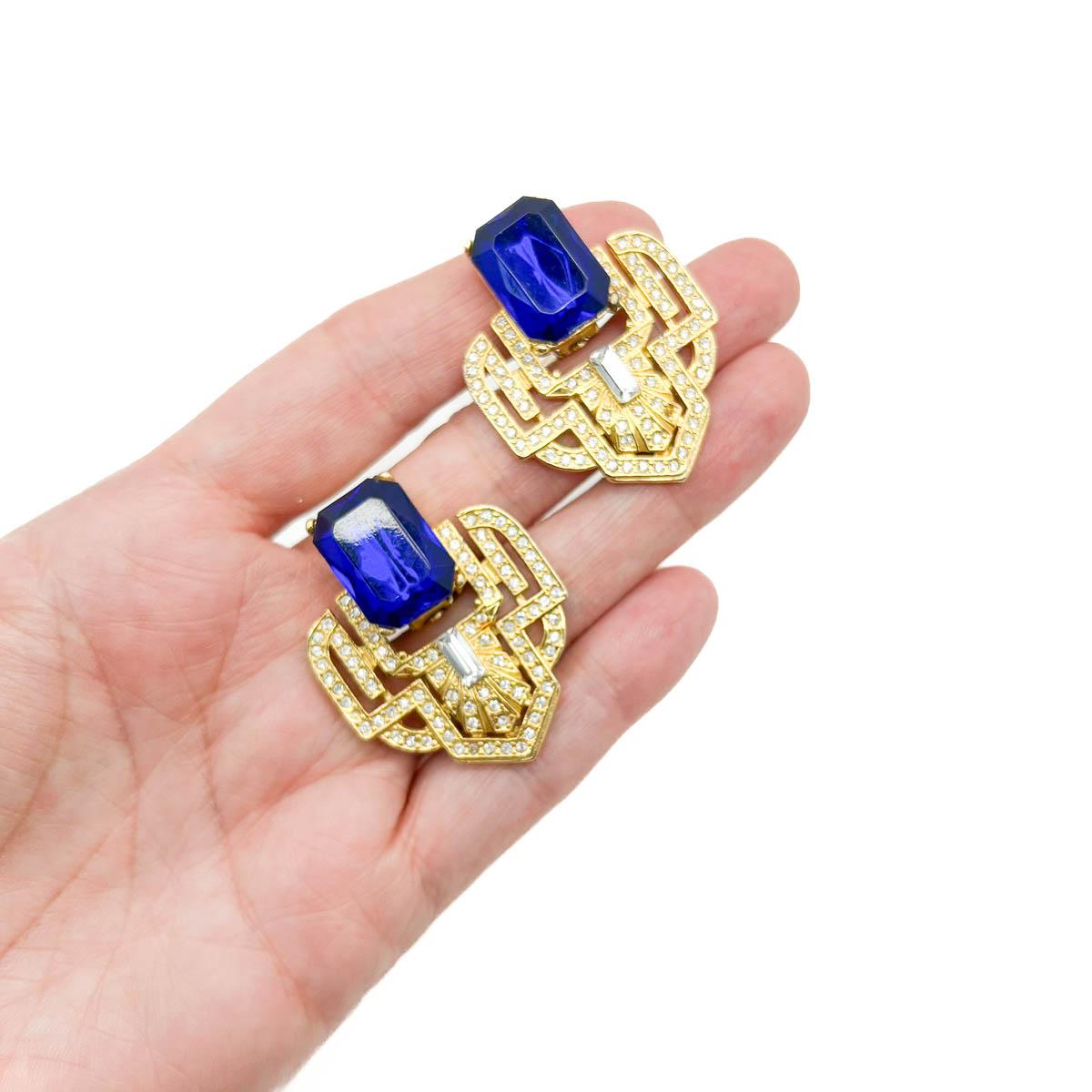 A Pair of Vintage Electric Blue Deco Earrings. Art Deco design and electric blue hues combine for a winning style statement.
An unsigned beauty. A rare treasure. Just because a jewel doesn’t carry a designer name, doesn’t mean it isn't coveted. The