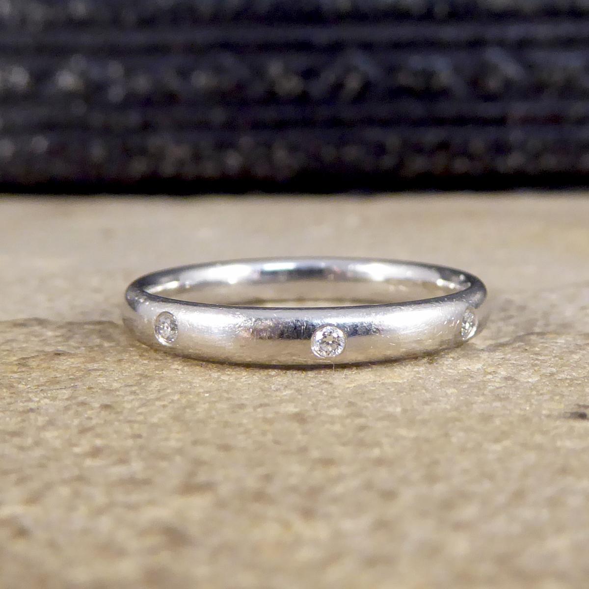 This simple vintage piece can be worn as a ring worn on any finger, or as a wedding band. It has three small Diamonds set into the head giving a minimal band a little extra special touch to it without being over the top, the perfect wedding band for
