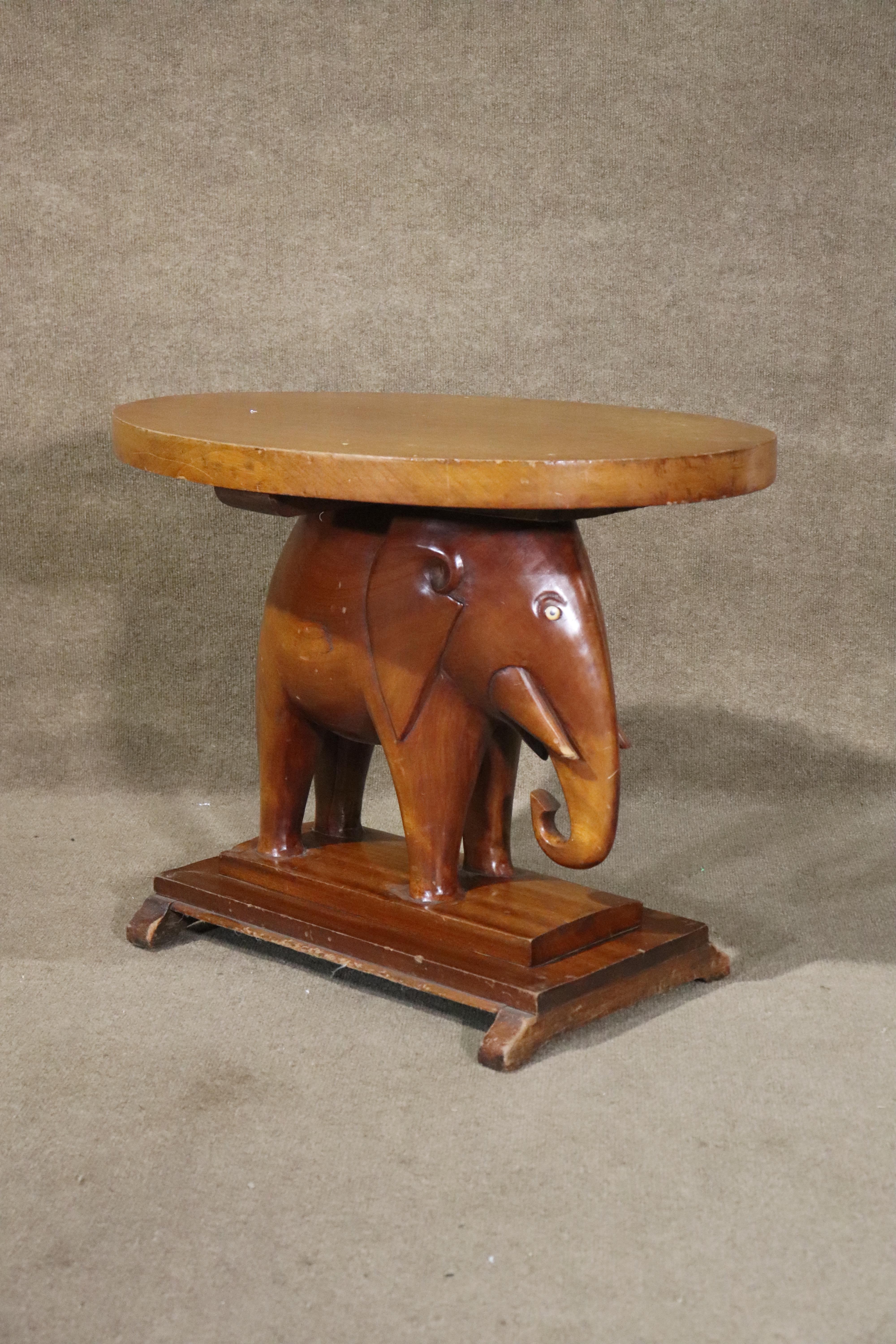 Oval top side table or plant stand. Hand crafted and carved in the shape of an elephant, this side table has a unique charm.
Please confirm location NY or NJ