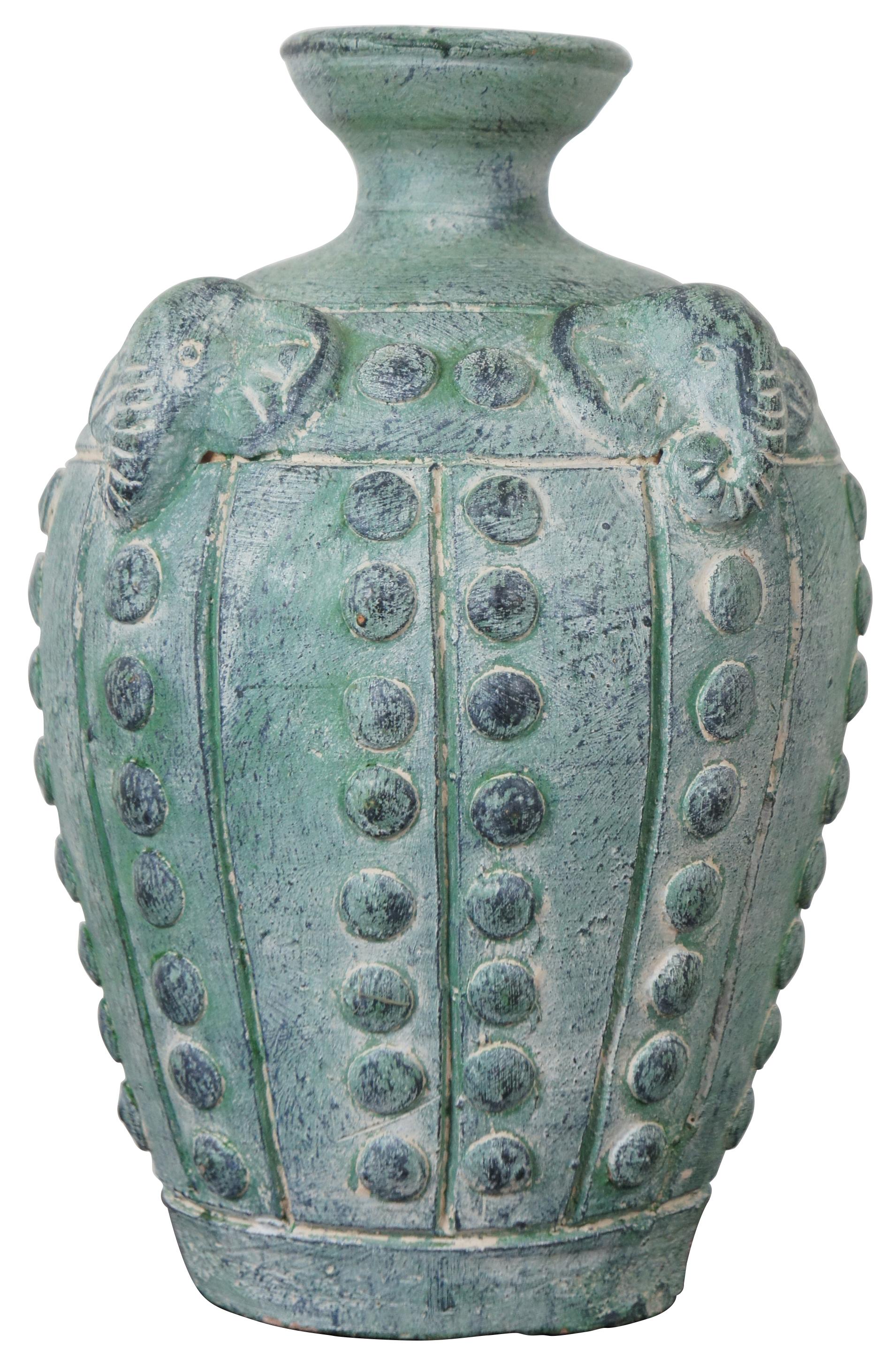 Vintage pottery vase, urn or jug with studded pattern accented with elephant heads with curled trunks. Measure: 10