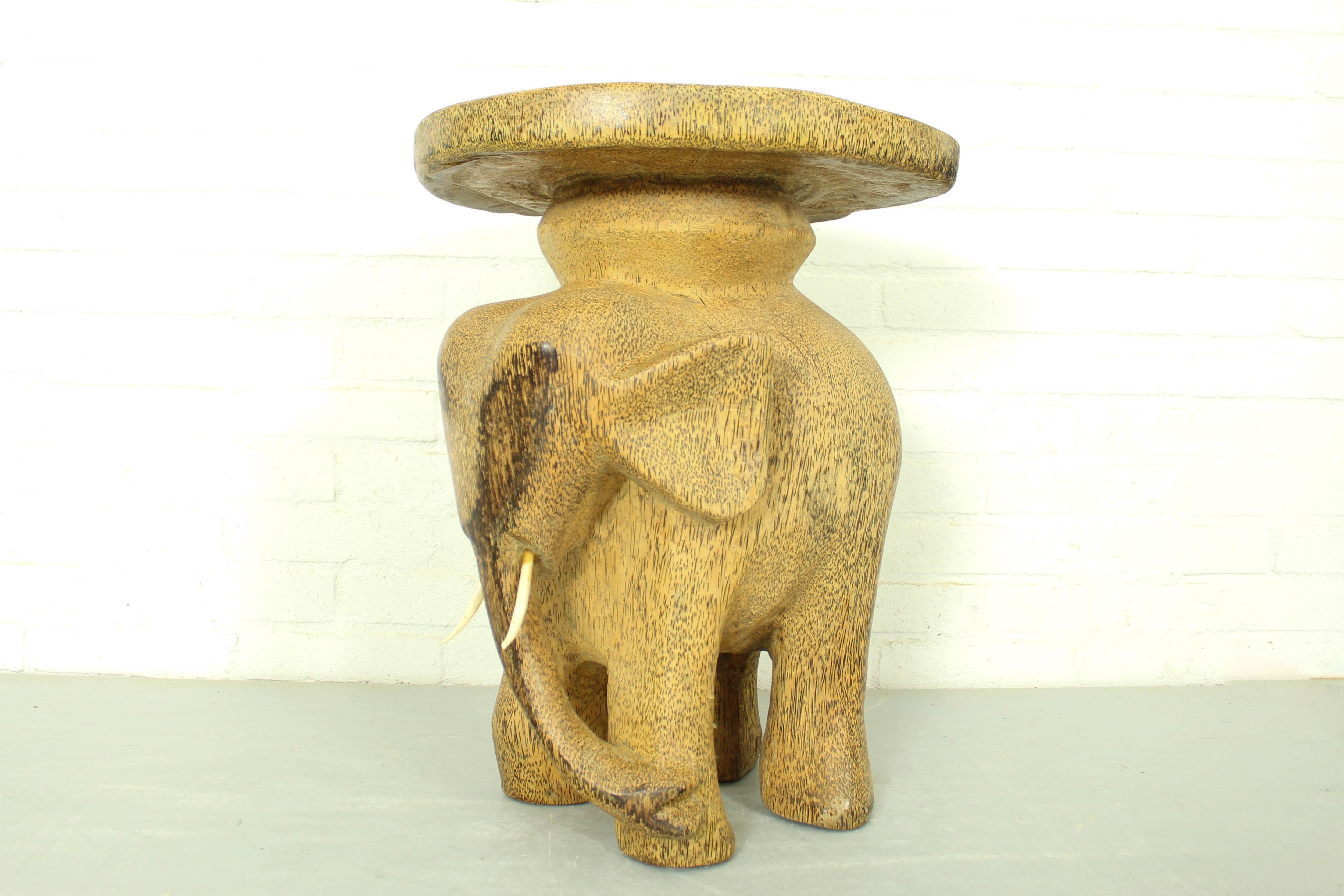 This beautiful Hollywood Regency elephant would make a great side table, stool or plant stand in your living room, sun room or garden room. 

Dimensions: 52cm h, 41cm d, 38cm w.