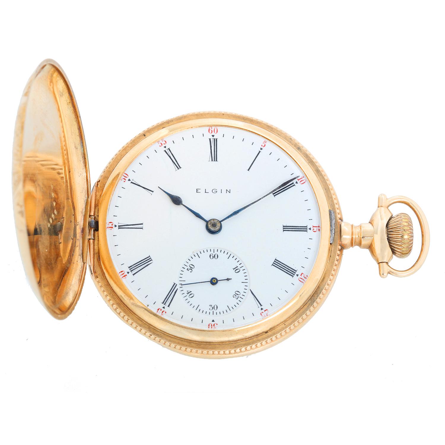 Vintage Elgin 14K Yellow Gold  165 Pocket Watch - Manual winding. 14K yellow gold hunter case with flower engraving ( 50 mm ). White dial with Roman numerals. Pre-owned with custom box.