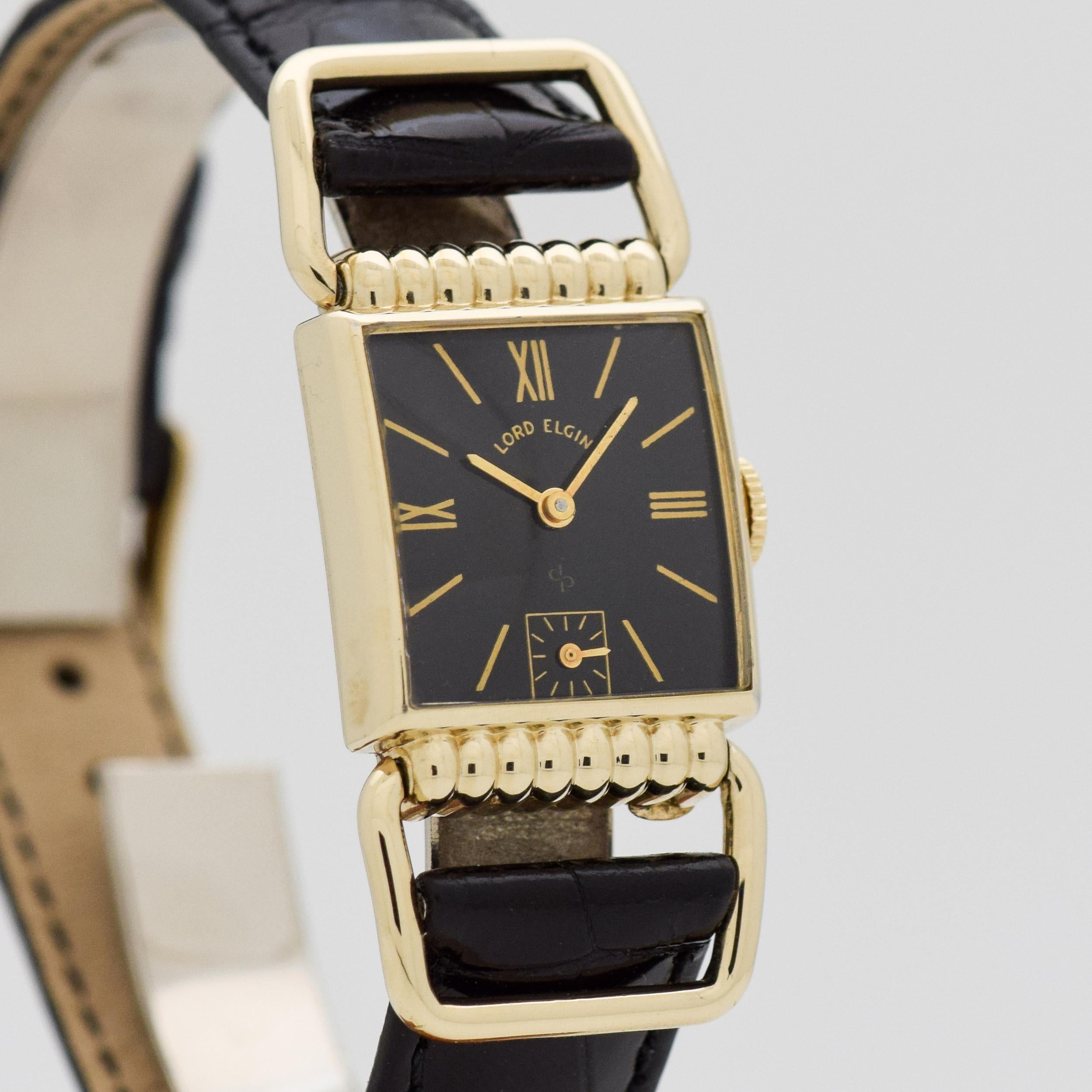 1950 Vintage Lord Elgin Driver's 14k Yellow Gold Filled watch with Original Black Dial with Gold Color Roman Numerals III/ IX, and XII. 20mm x 41mm lug to lug (0.79 in. x 1.61 in.) - 21 jewel, manual caliber movement. Equipped with a 100% Genuine