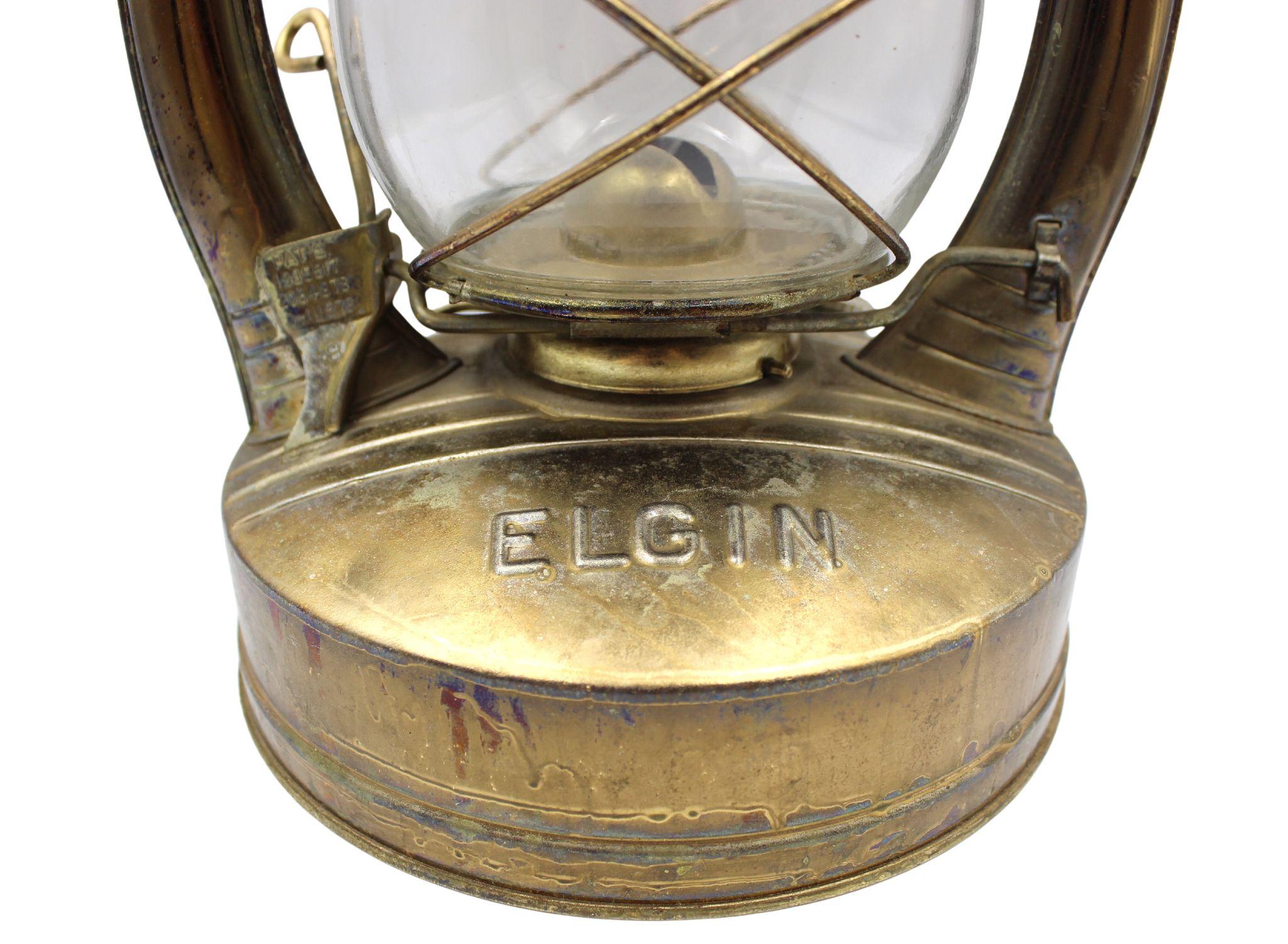 Presented is a vintage Elgin railroad kerosene lantern, with a clear glass globe and wire caging.  The lantern was originally used on the Chicago Aurora and Elgin Railroad, in Illinois. Kerosene lanterns just like this one were used daily by