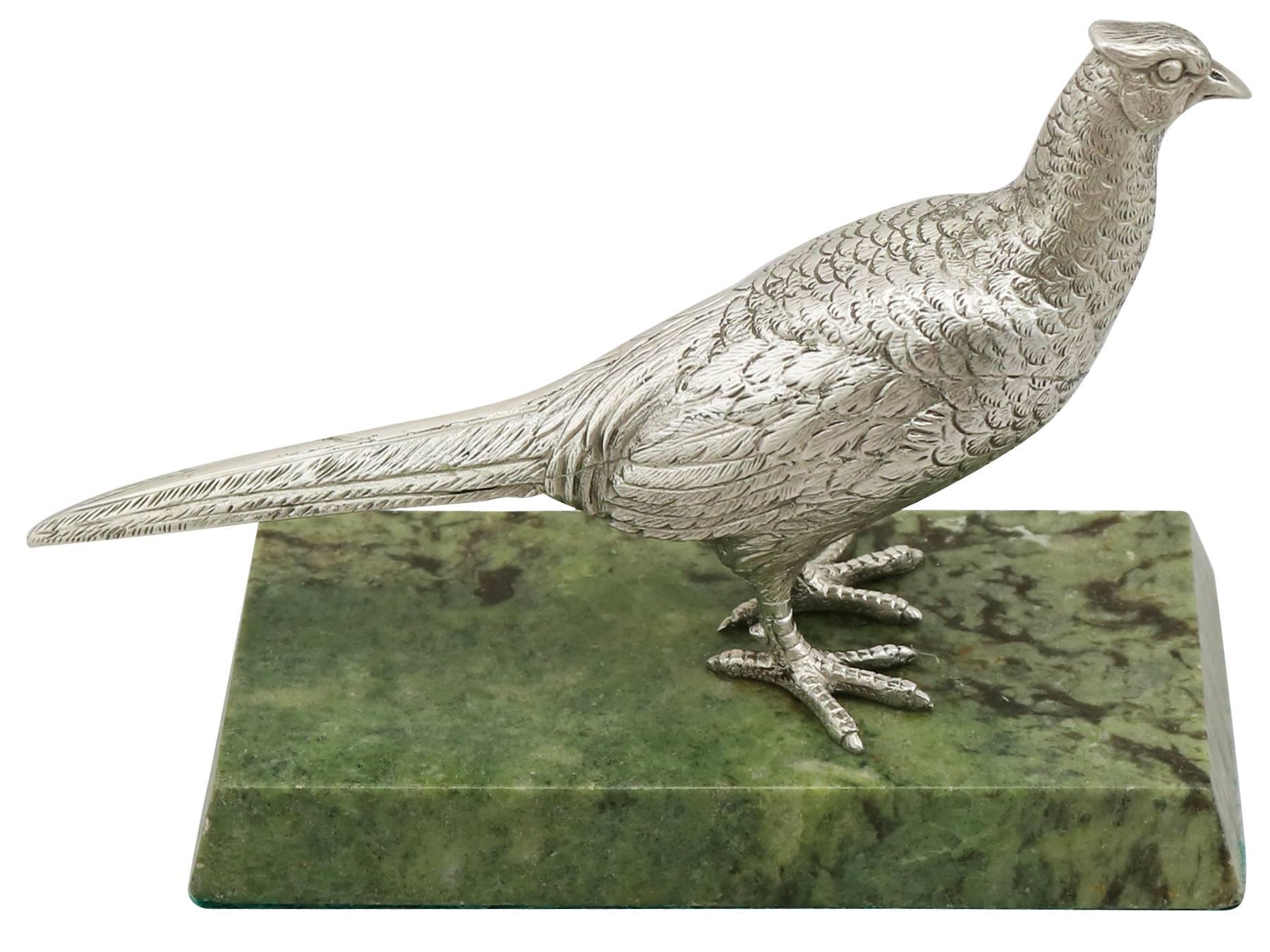 An exceptional, fine and impressive vintage Elizabeth II English sterling silver presentation hen pheasant; an addition to our silverware collection.

This exceptional vintage Elizabeth II cast sterling silver presentation piece has been