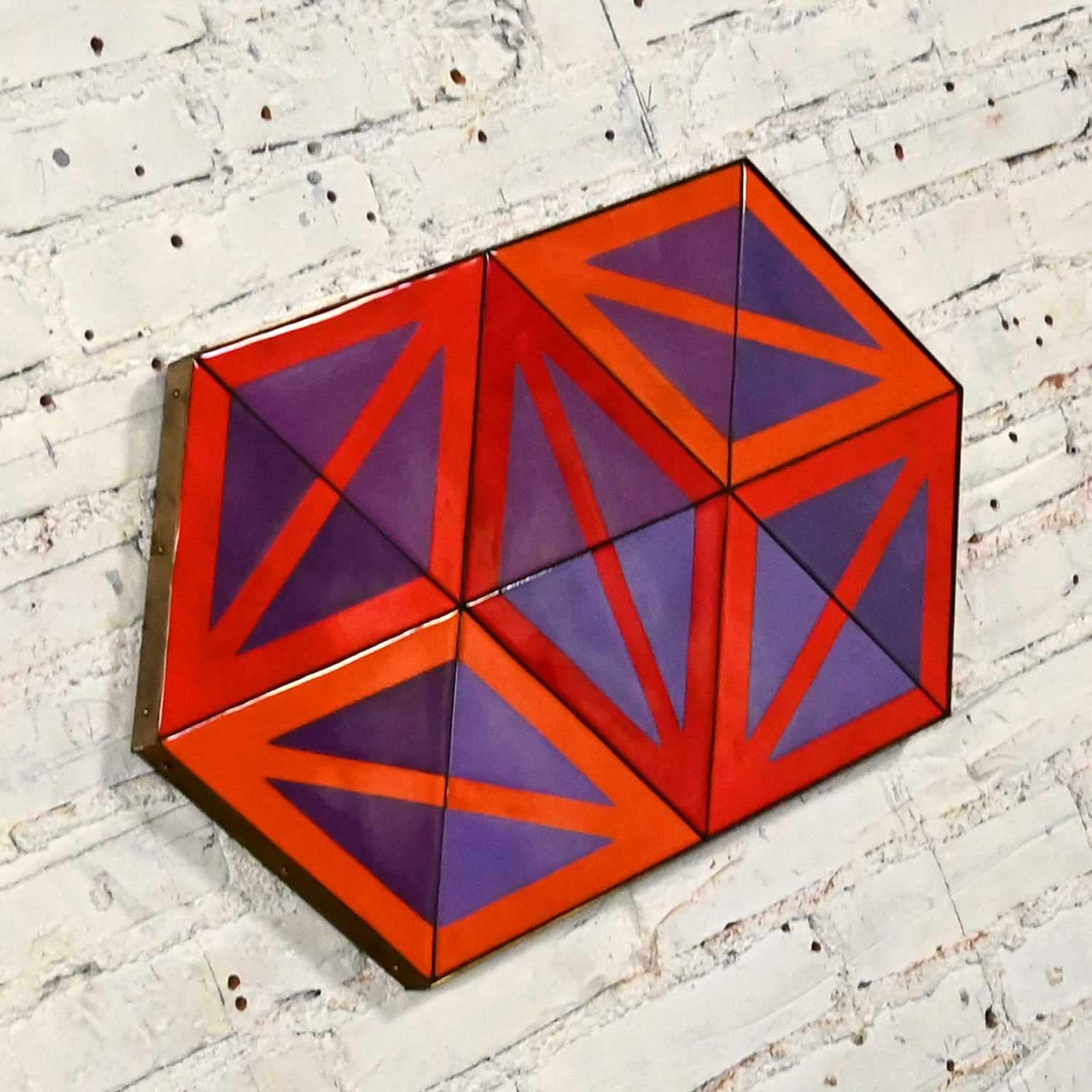 Phenomenal vintage Mid-Century Modern enamel on copper geometric wall sculpture signed by Ellamarie Wooley and numbered 534. Beautiful condition, keeping in mind that this is vintage and not new so will have signs of use and wear. Brass strap frame