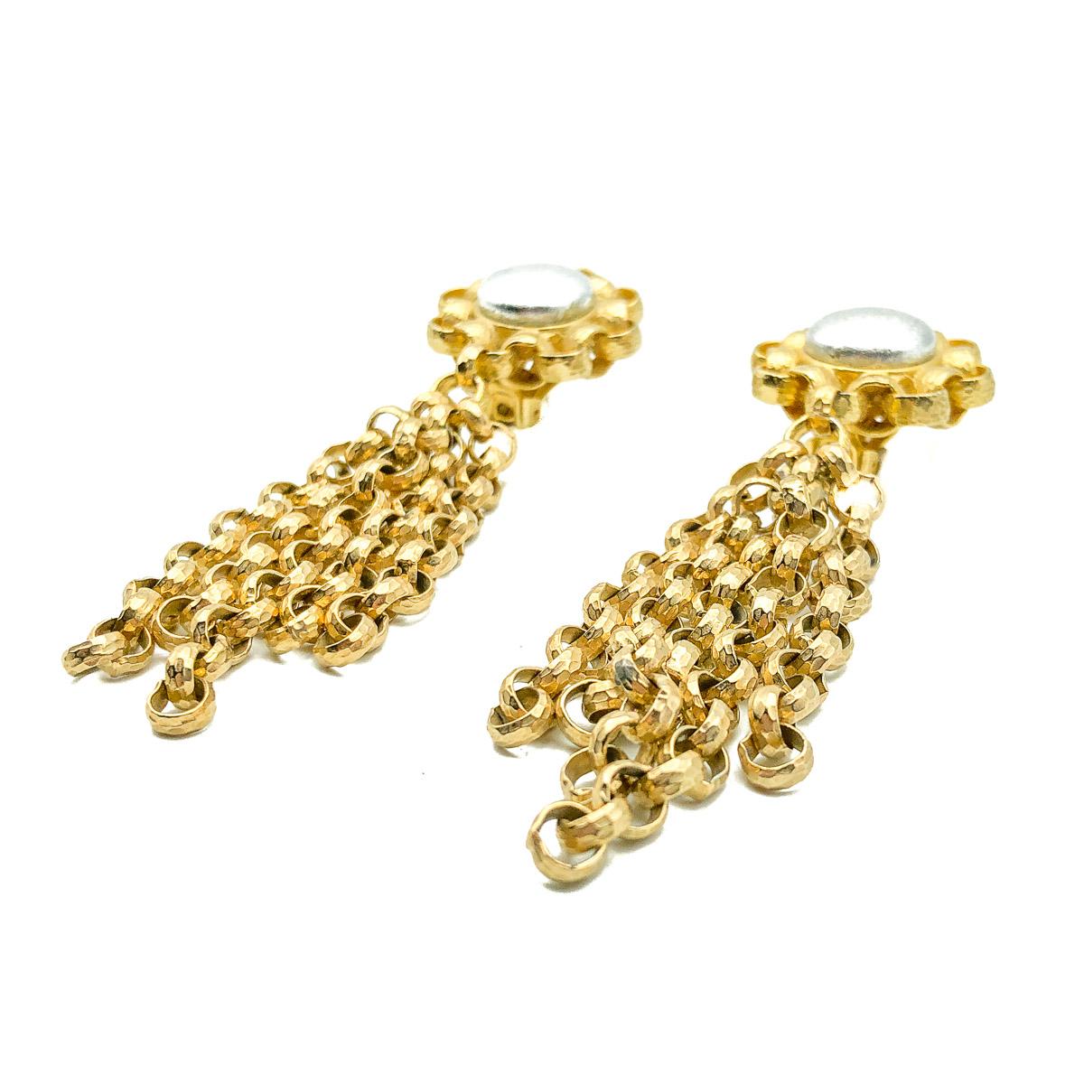 A strikingly cool pair of Vintage Ellen Designs Tassle Earrings. Crafted in gold plated metal and silver leather. Ellen Designs was created by Ellen, the daughter of the successful mid-century American costume jewellery brand 'Robert Originals'. In