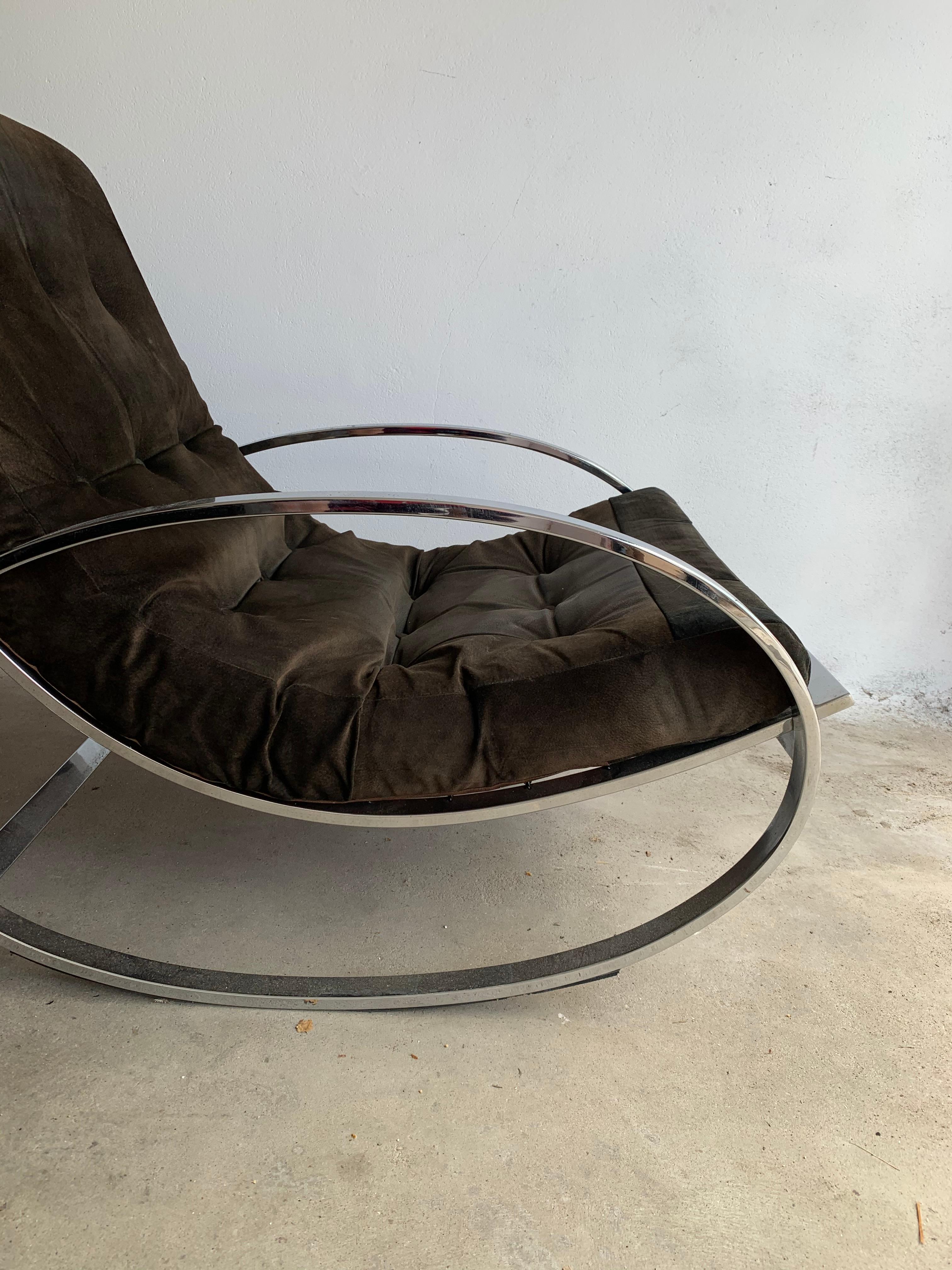 Original upholstery of natural nubuk that wraps the user in comfort and supported by a gently curved back and polished chrome frame in good original condition, This streamlined modernist chair is the ultimate in luxurious comfort. Produced, circa