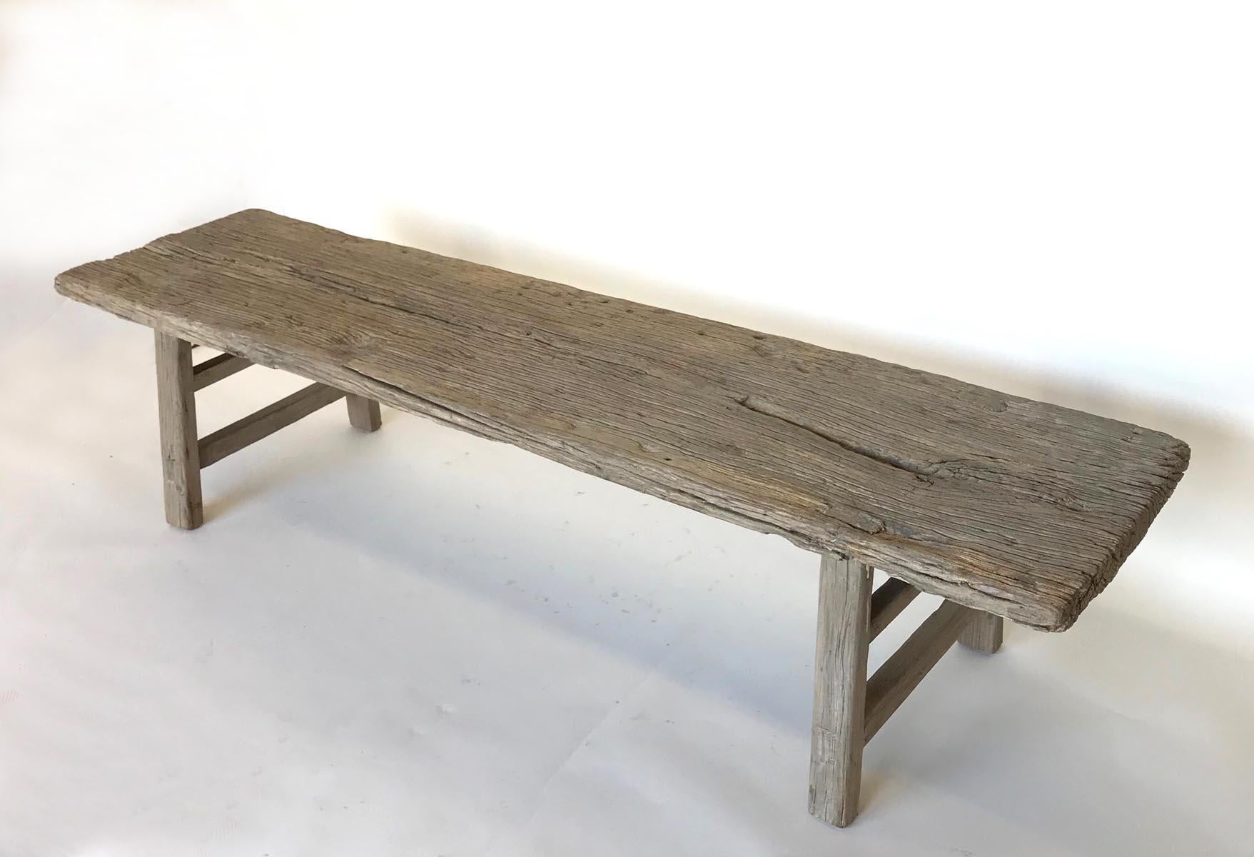 Vintage elm bench with great, weathered patina. Mortise and Tenon construction, double side stretchers. Can work as a bench, low console or coffee table.
