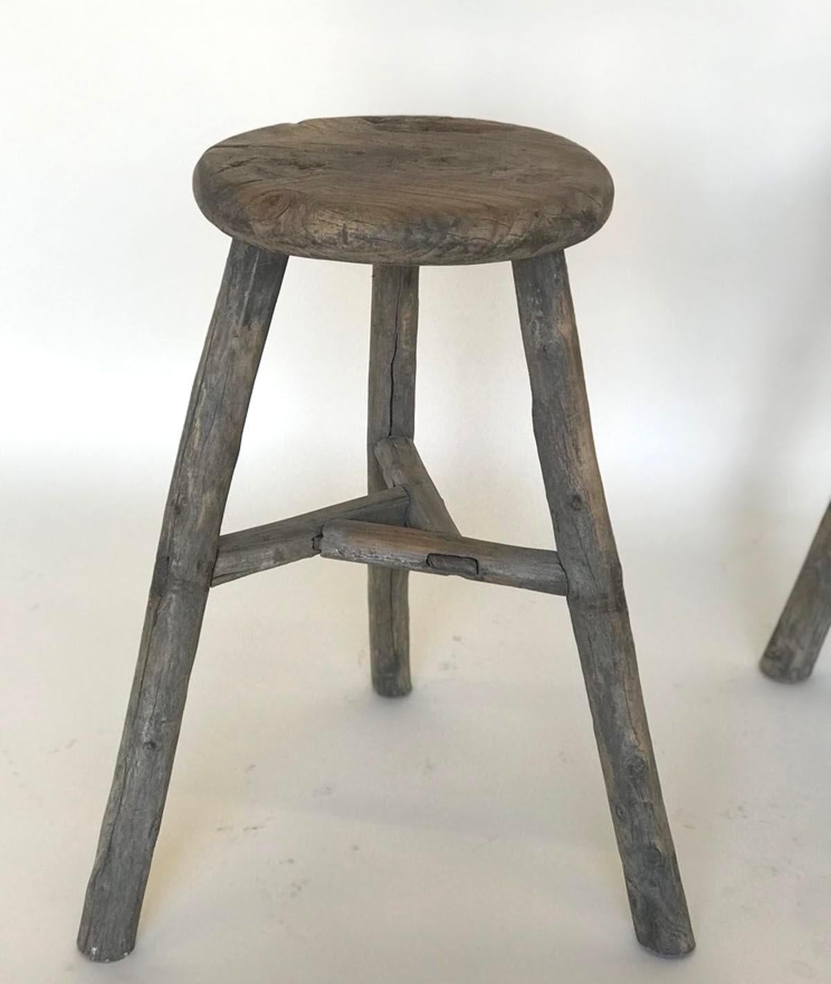 Three vintage elm stools with different configuration on stretchers. Lovely weathered, smooth patina on wood. Mortise and Tenon construction. Great for extra seating or as a plant stand.
Sold and priced separately.
Measures: Left 11 D x 21 H list