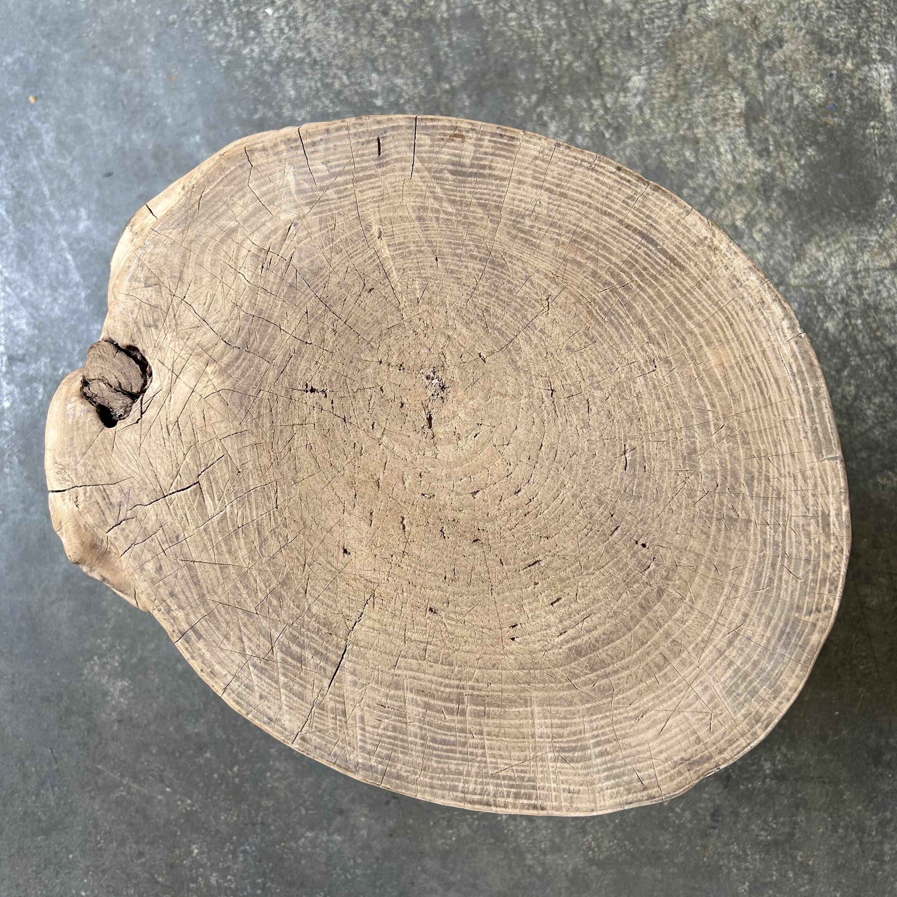 This solid stump slice was turned into a side table or stool. The solid thick top has a beautiful movement with unique characteristics. A natural live edge to show shape and form of what was. Solid and sturdy, perfect earthy organic piece to add to