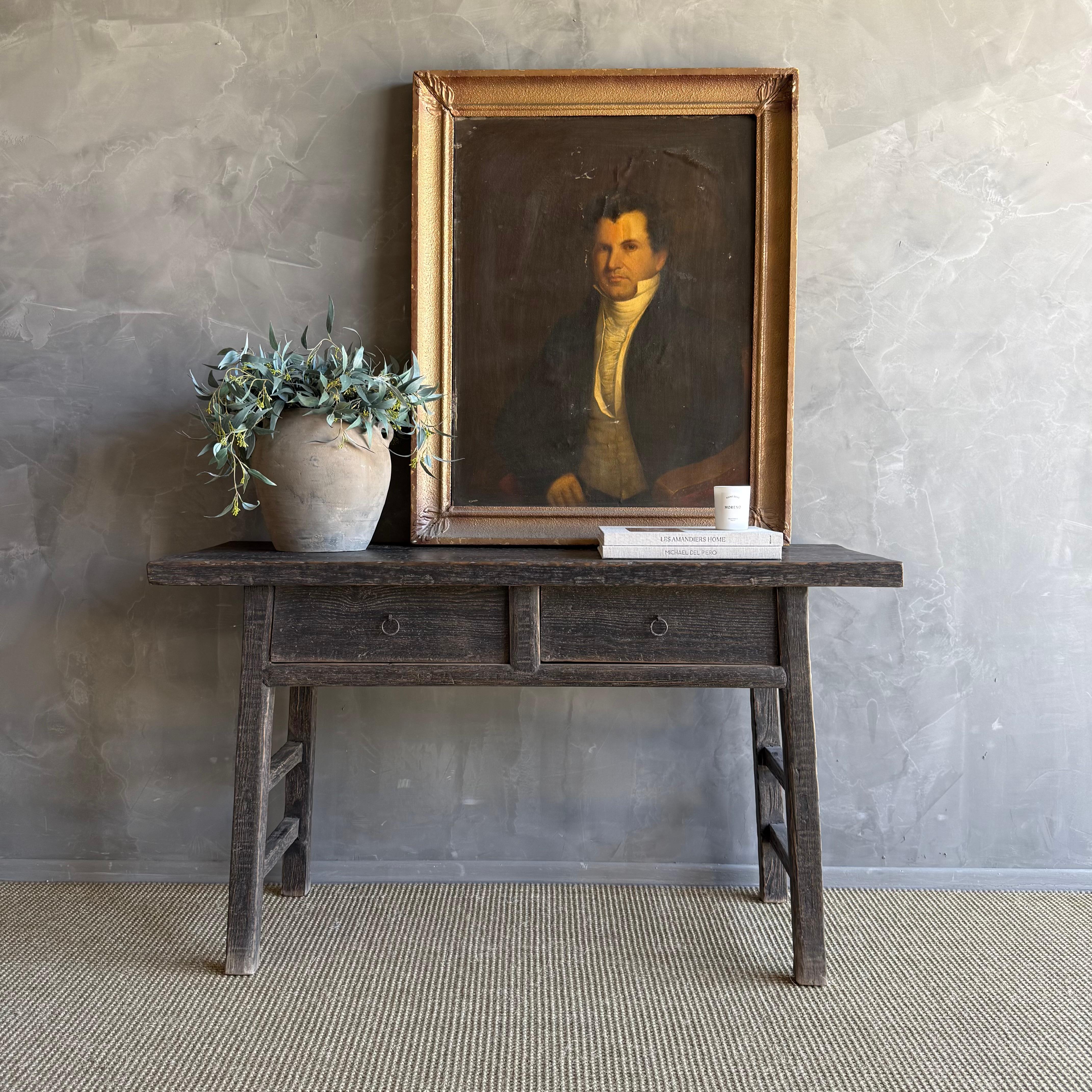 This charming vintage elm wood console is a one-of-a-kind piece with beautiful age and patina that adds character to any space. Its patina painted elm wood finish showcases the natural beauty of the wood, while the solid elm wood original hardware