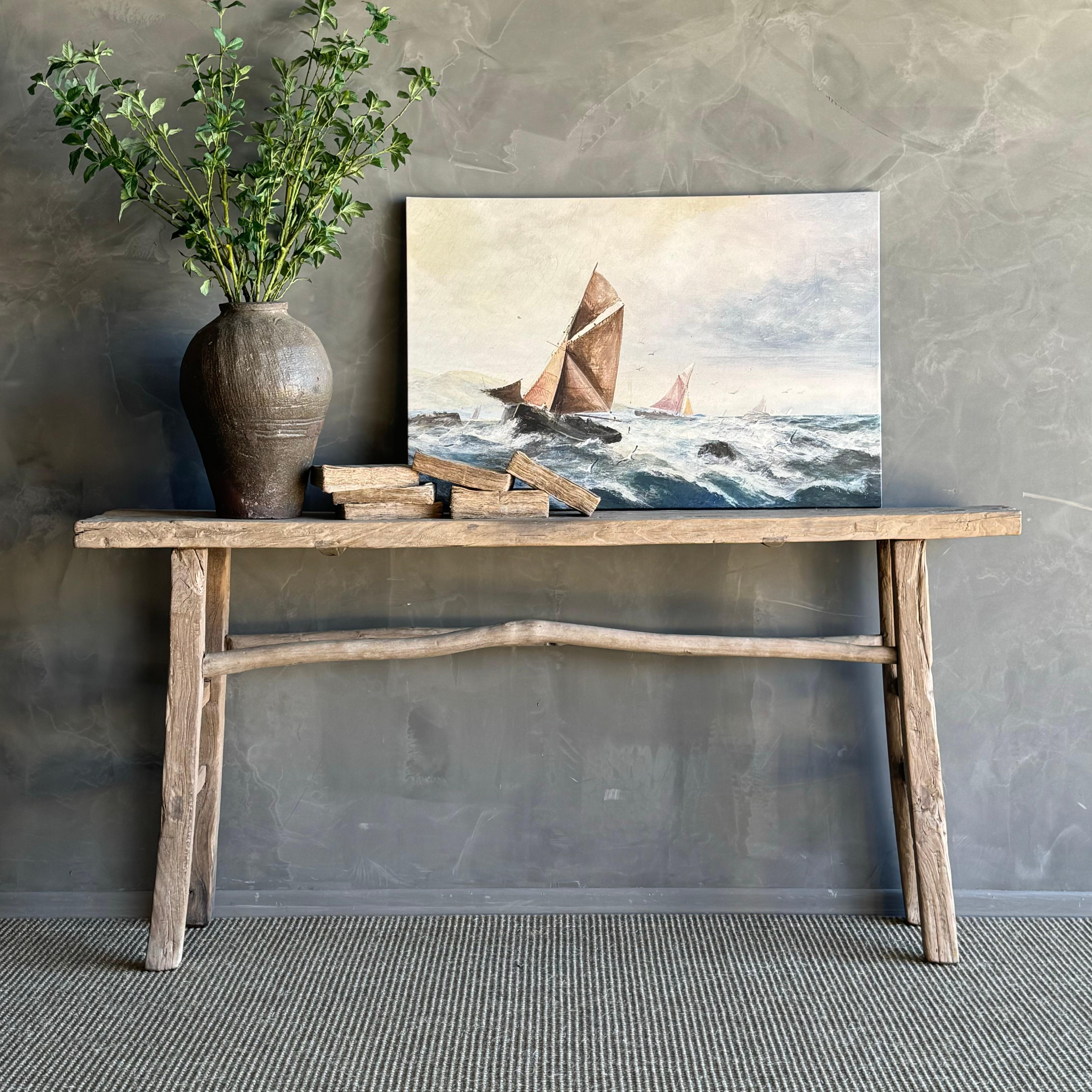 Vintage elm wood console table. Crafted from authentic elm wood, this console table boasts a beautiful original natural wood patina that adds character and charm to any room. Embracing the wabi-sabi aesthetic, this piece brings a sense of