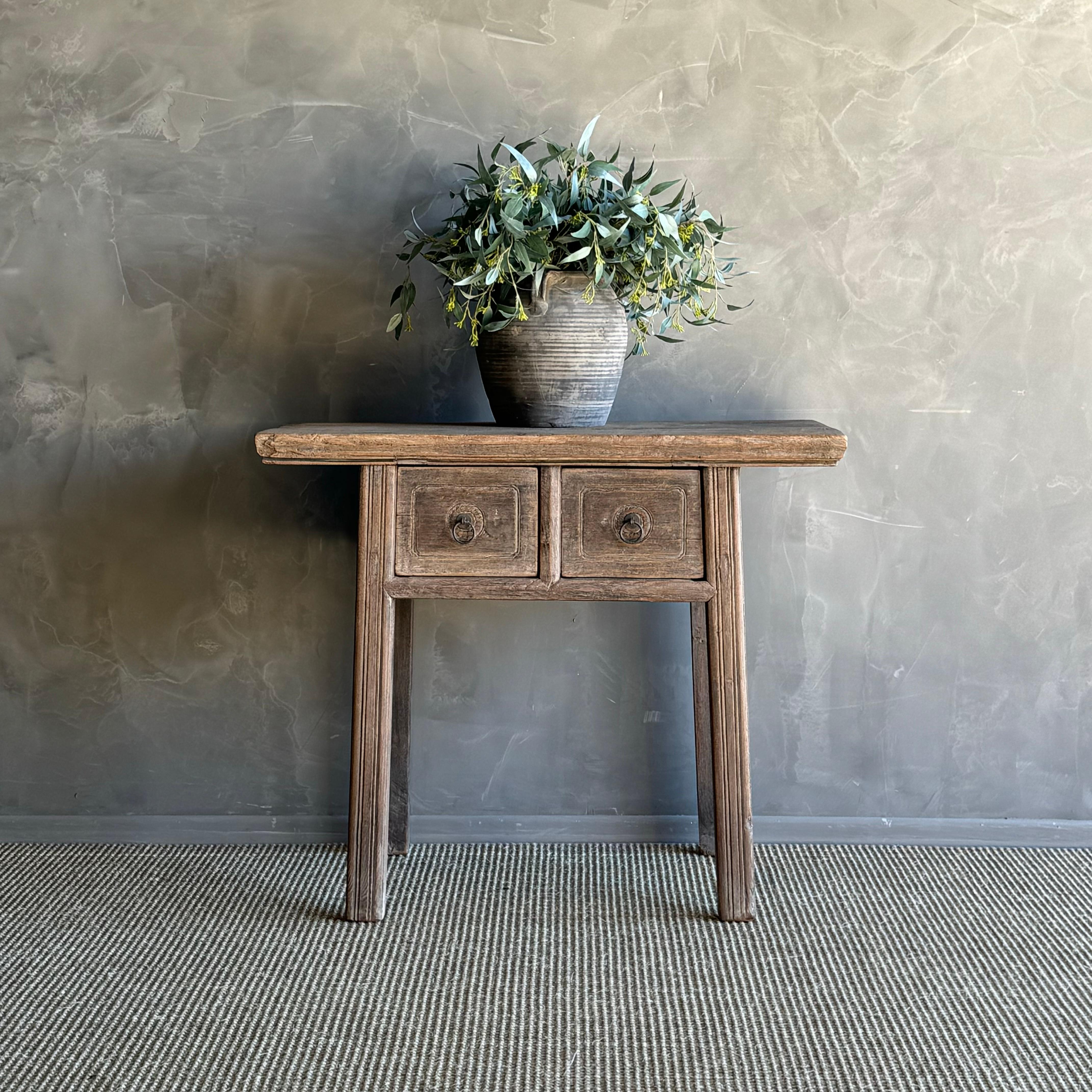 Vintage elm wood drawer console table, a true gem for your home decor. This authentic console table is crafted from elm wood and features drawers with original natural wood patina, adding a touch of character and charm to any space. The rare find