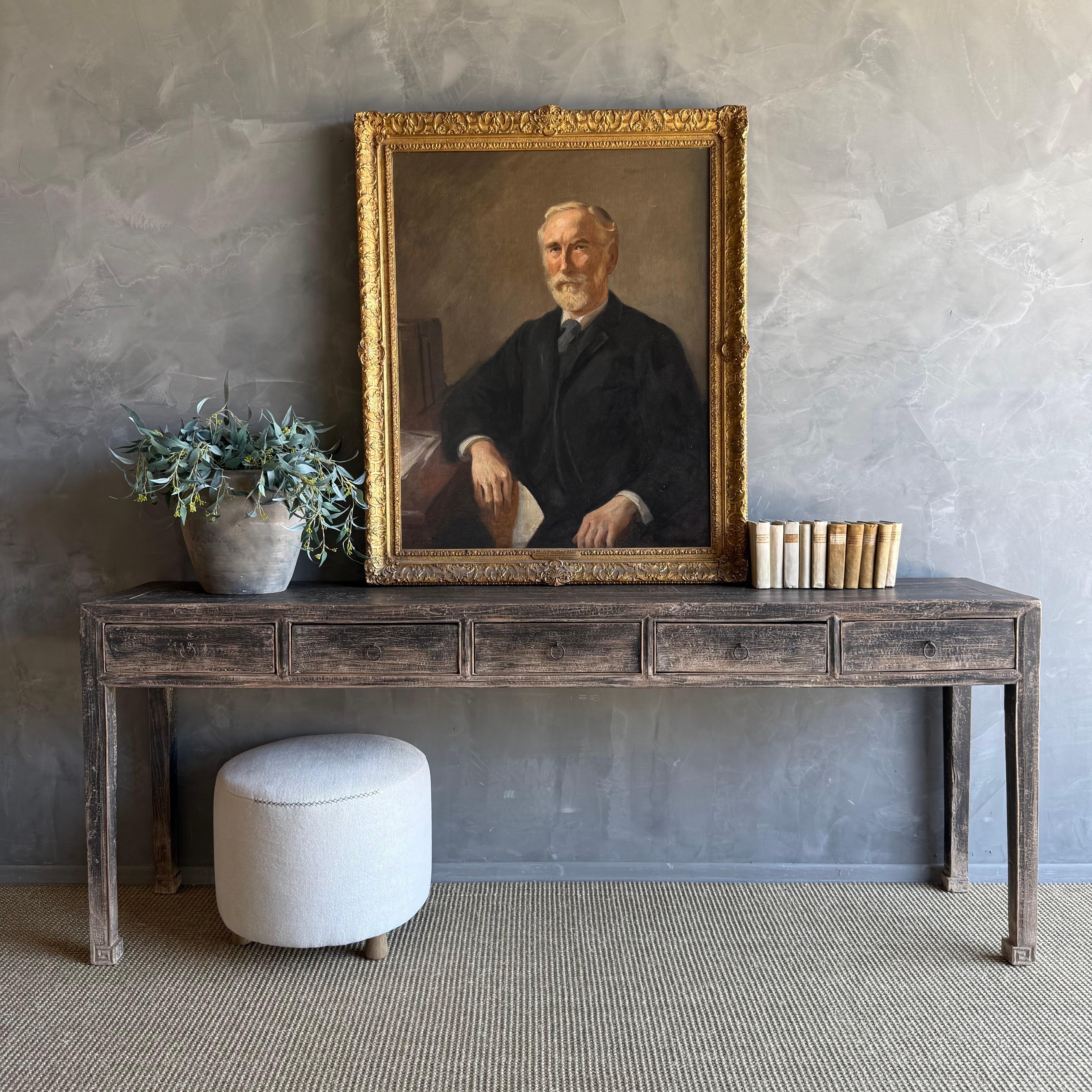 This charming vintage elm wood console is a one-of-a-kind piece with beautiful age and patina that adds character to any space. Its patina painted elm wood finish showcases the natural beauty of the wood, while the solid elm wood original hardware