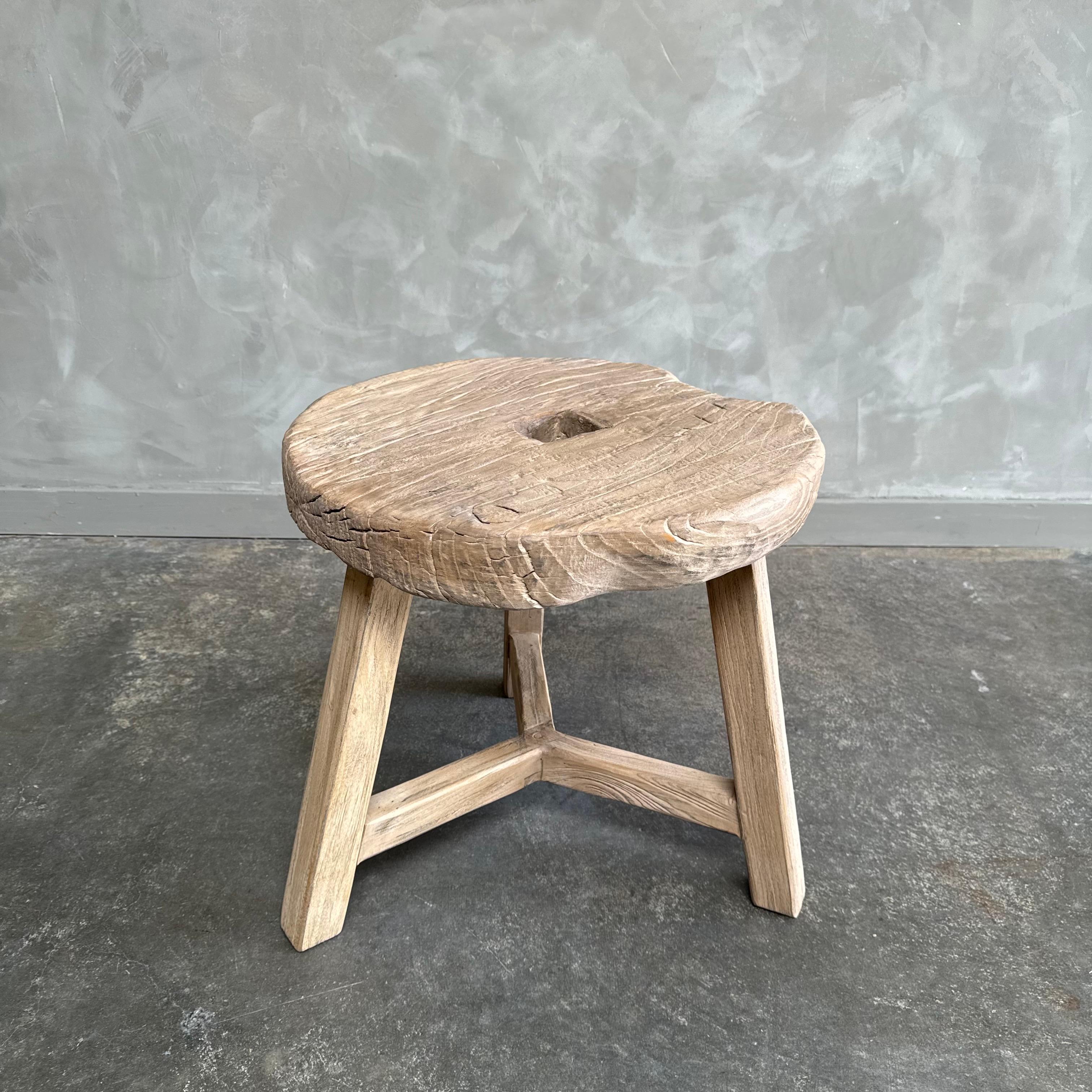 Antique wheel side table. This vintage elm wood wheel table is finished with medium to dark stain. The table is solid and sturdy ready for everyday use. Use as a side table, stool, powder room to add vintage style to your home. One of a kind