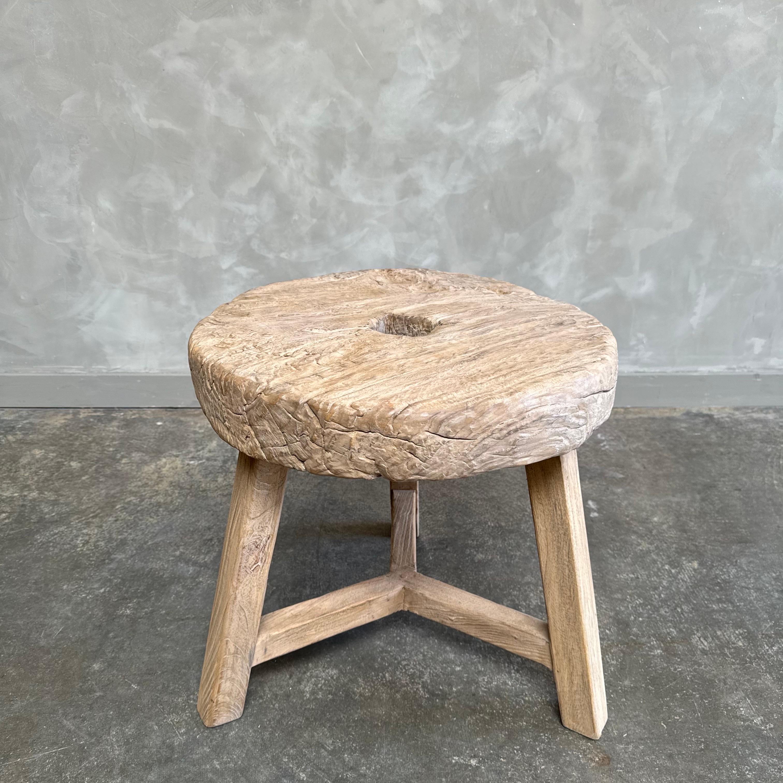 Antique wheel side table. This vintage elm wood wheel table is finished with medium to dark stain. The table is solid and sturdy ready for everyday use. Use as a side table, stool, powder room to add vintage style to your home. One of a kind item.
