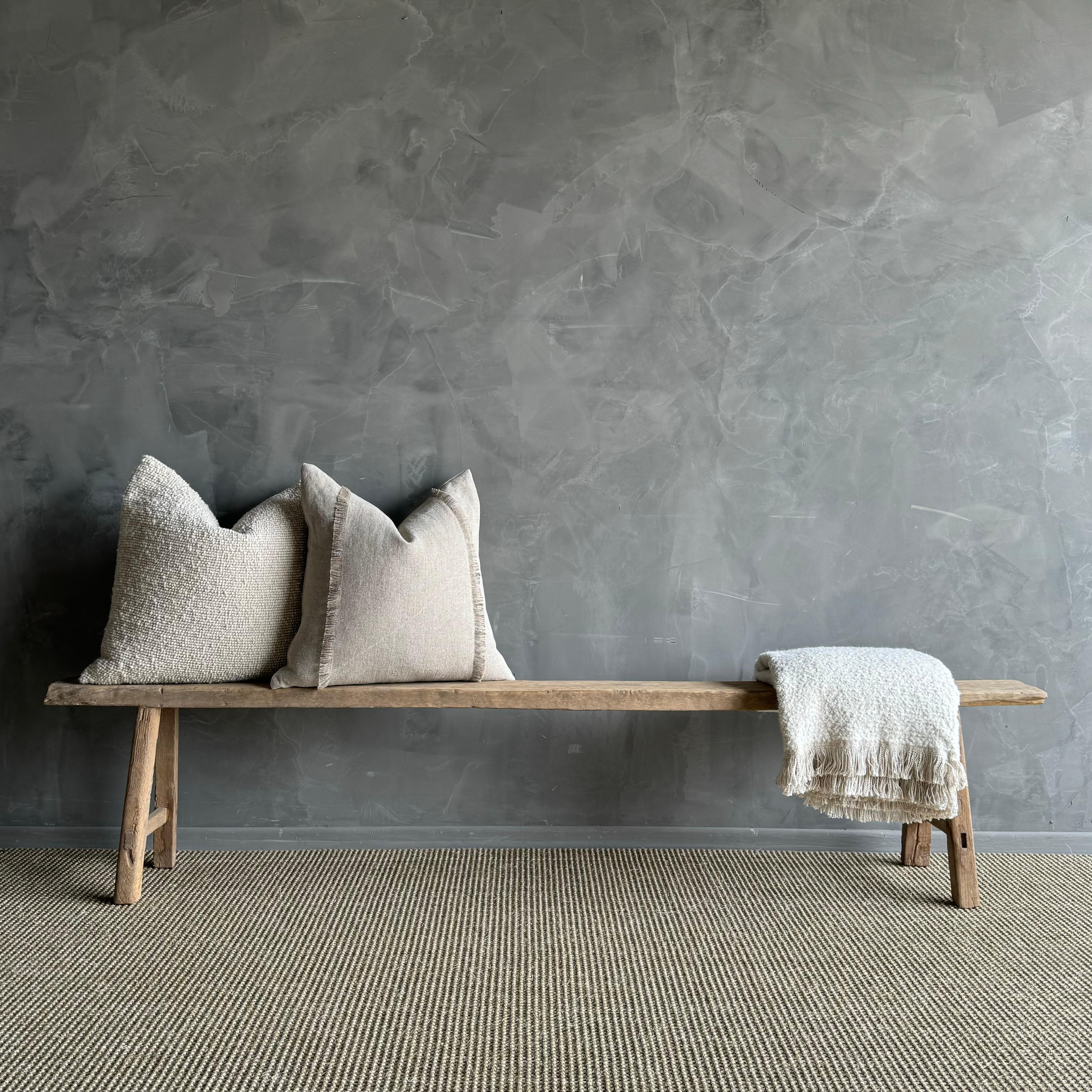 a rare find - the Vintage Elm Wood Long Skinny Bench. This authentic vintage elm bench is a true gem, with a hard-to-find extra long length that makes it stand out. The beautiful grain and fissures add character to each piece, making it truly unique