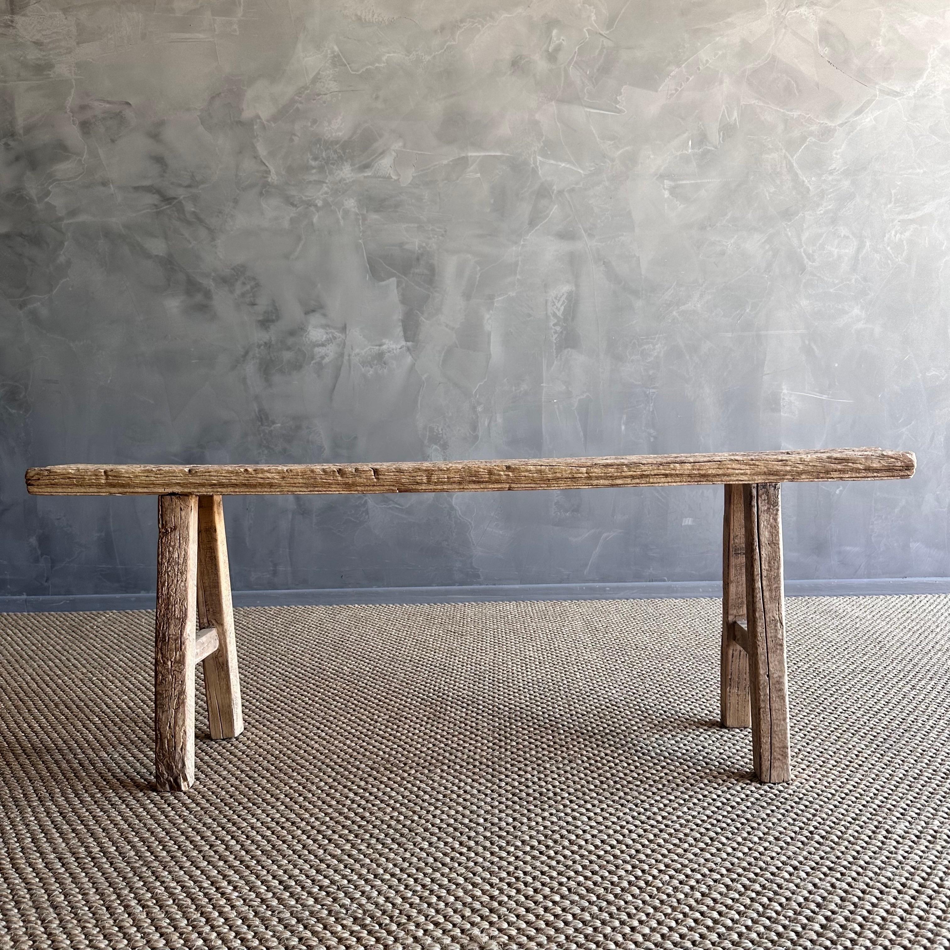 Vintage elm skinny bench.
Crafted from reclaimed elm wood, this bench is not only solid and sturdy but also exudes a charming rustic charm. Perfect for adding character to any room, this bench is ideal for placing at the end of a bed, in the