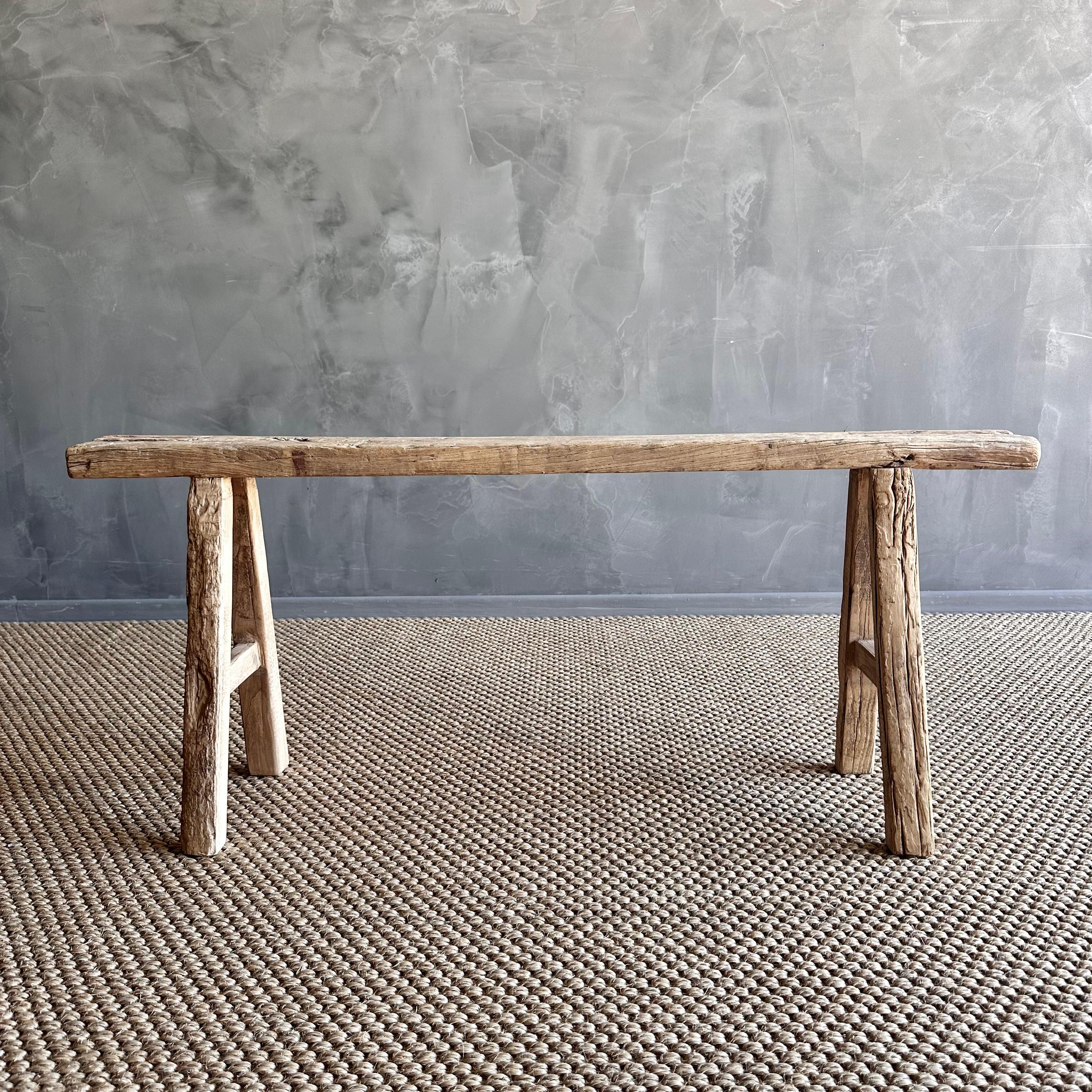 Vintage elm skinny bench.
Crafted from reclaimed elm wood, this bench is not only solid and sturdy but also exudes a charming rustic charm. Perfect for adding character to any room, this bench is ideal for placing at the end of a bed, in the