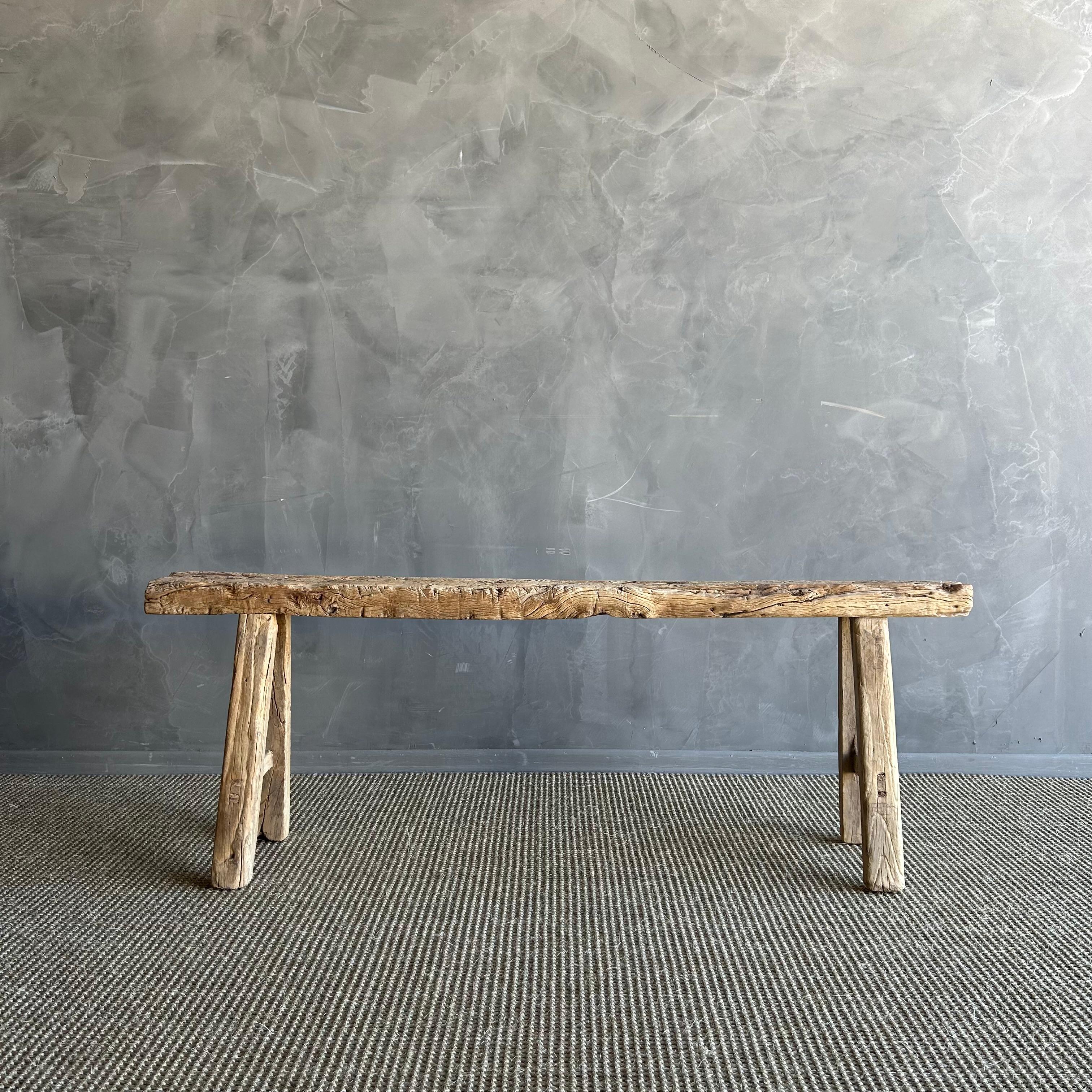 Vintage elm skinny bench.
Crafted from reclaimed elm wood, this bench is not only solid and sturdy but also exudes a charming rustic charm. Perfect for adding character to any room, this bench is ideal for placing at the end of a bed, in the