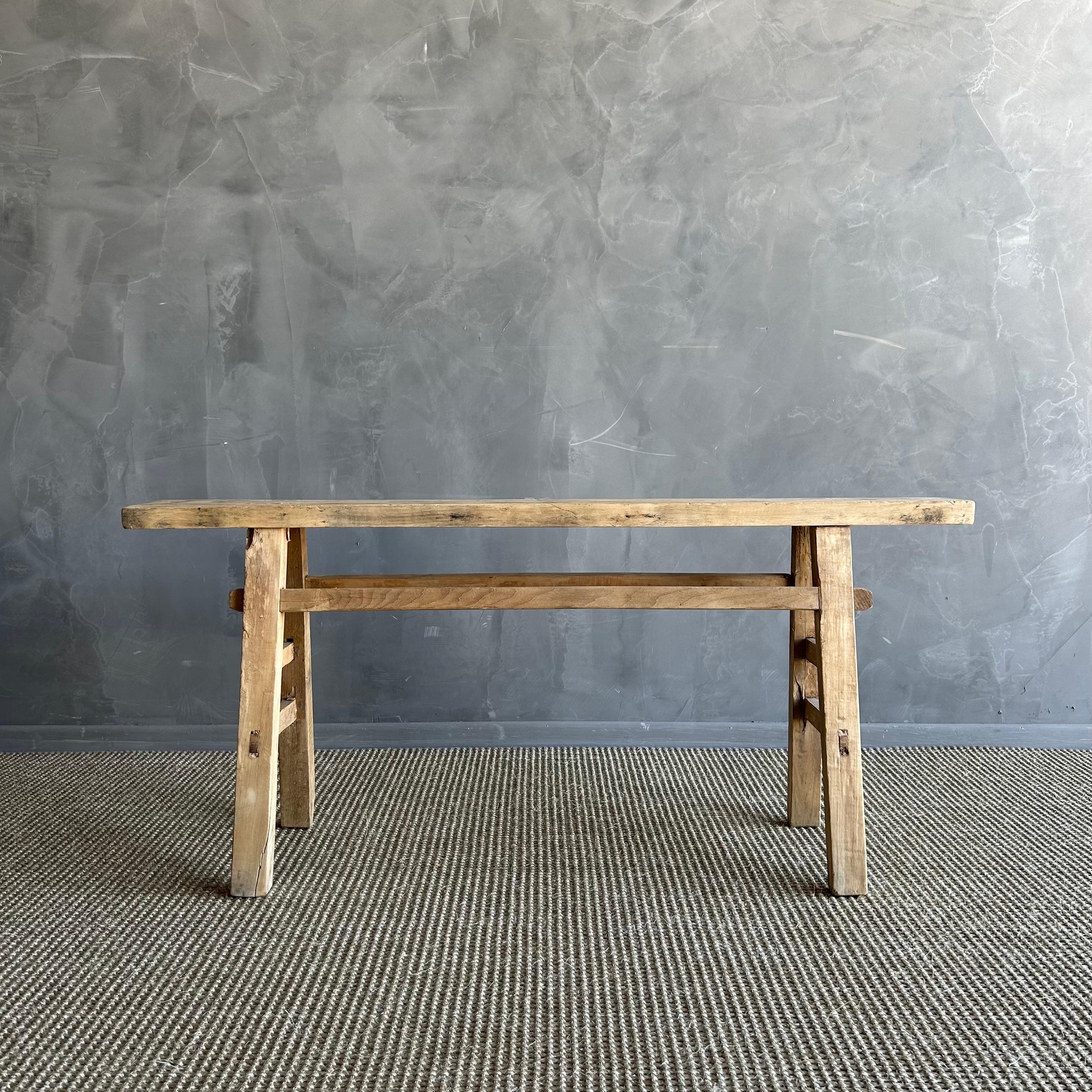 Vintage elm skinny bench.
Crafted from reclaimed elm wood, this bench is not only solid and sturdy but also exudes a charming rustic charm. Perfect for adding character to any room, this bench is ideal for placing at the end of a bed, in the