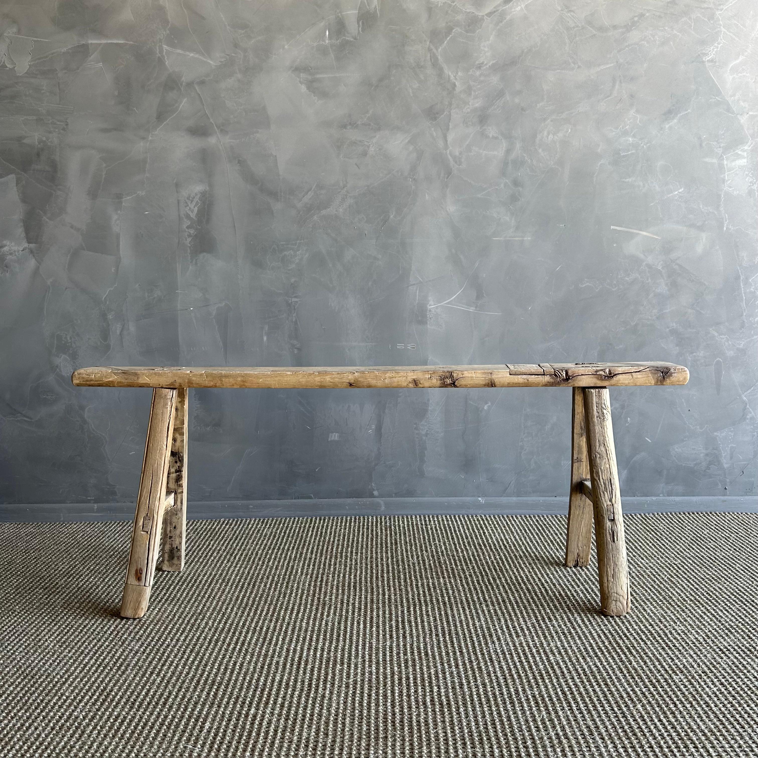 Vintage elm skinny bench.
Crafted from reclaimed elm wood, this bench is not only solid and sturdy but also exudes a charming rustic charm. Perfect for adding character to any room, this bench is ideal for placing at the end of a bed, in the
