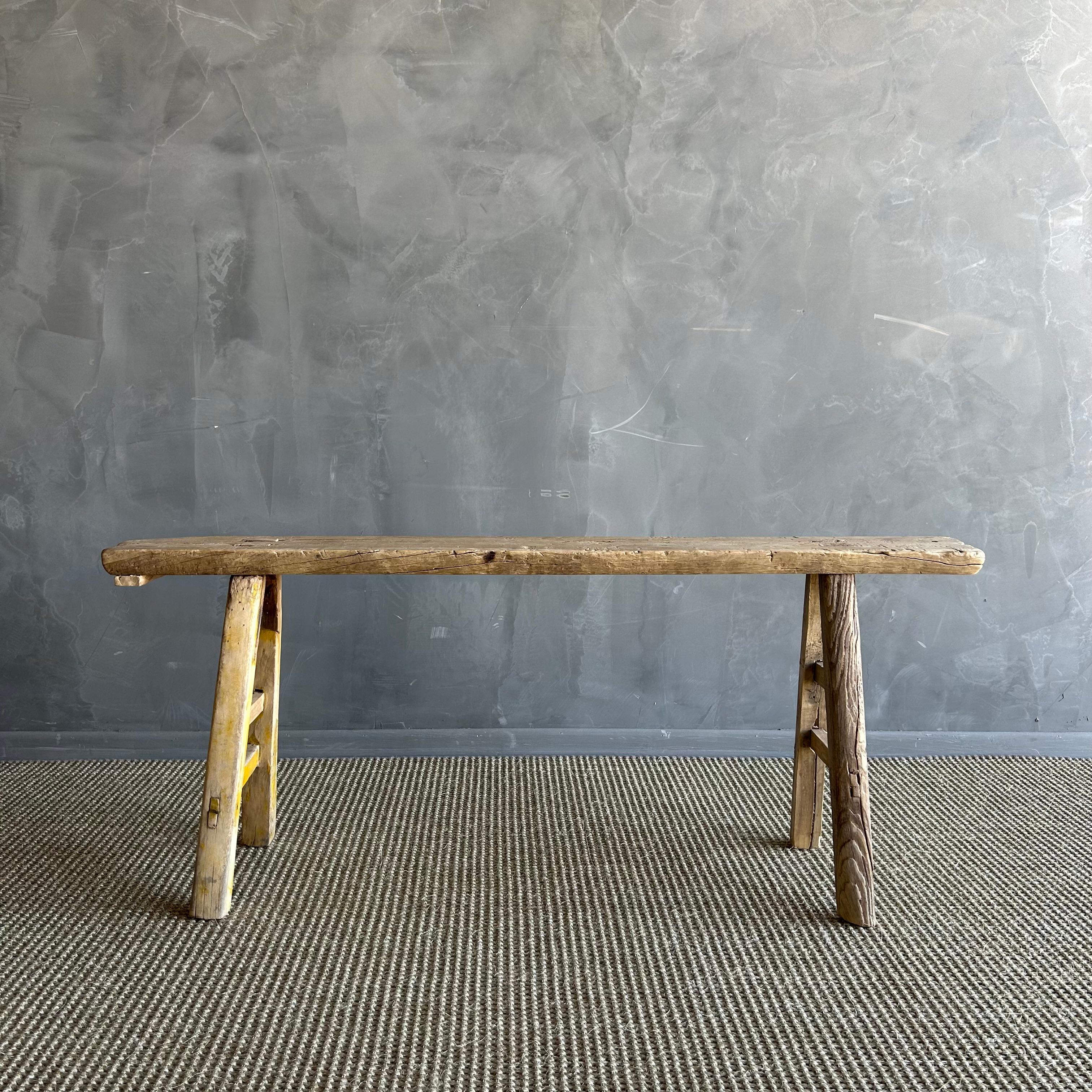 Vintage elm skinny bench.
Crafted from reclaimed elm wood, this bench is not only solid and sturdy but also exudes a charming rustic charm. Perfect for adding character to any room, this bench is ideal for placing at the end of a bed, in the