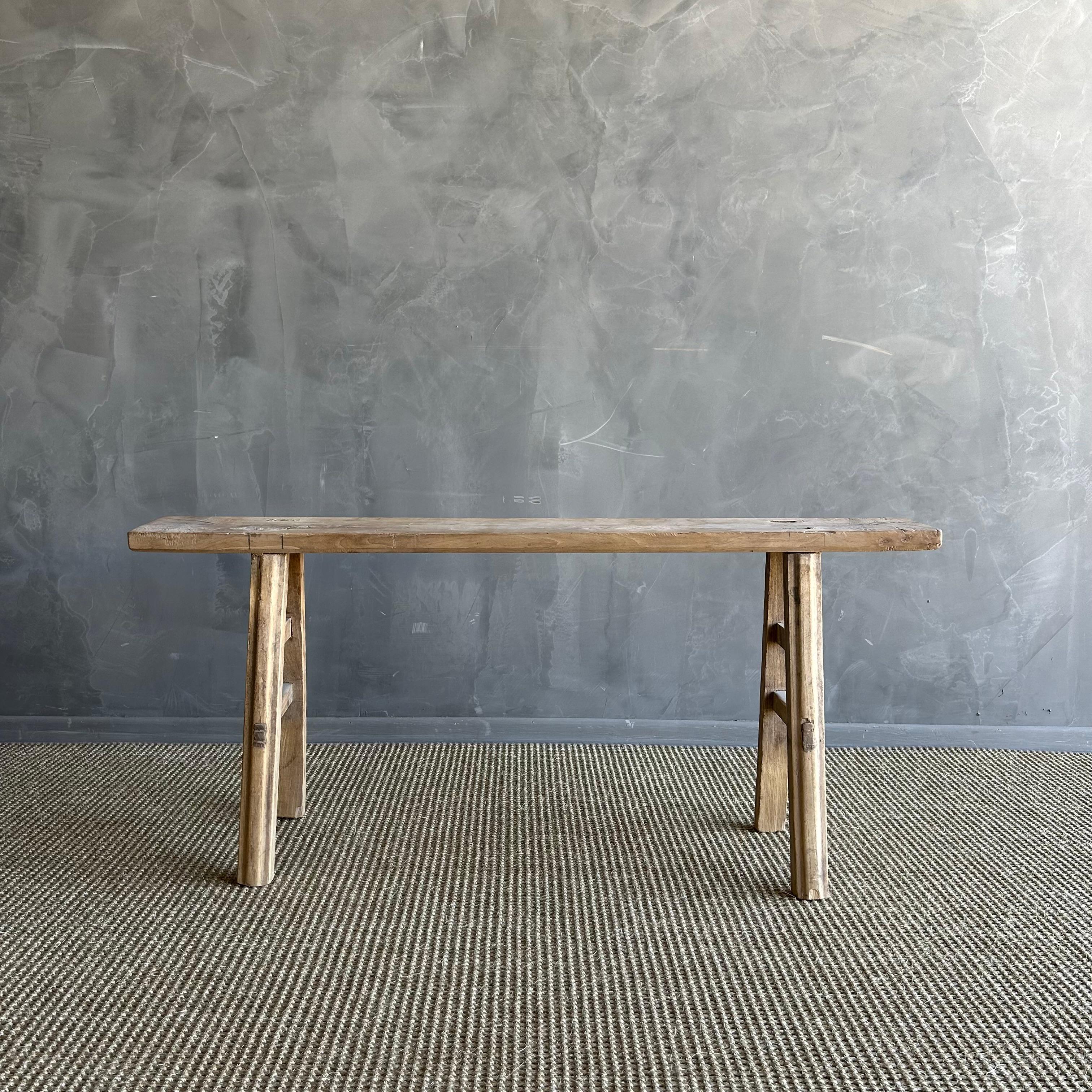 Vintage elm skinny bench.
Crafted from reclaimed elm wood, this bench is not only solid and sturdy but also exudes a charming rustic charm. Perfect for adding character to any room, this bench is ideal for placing at the end of a bed, in the