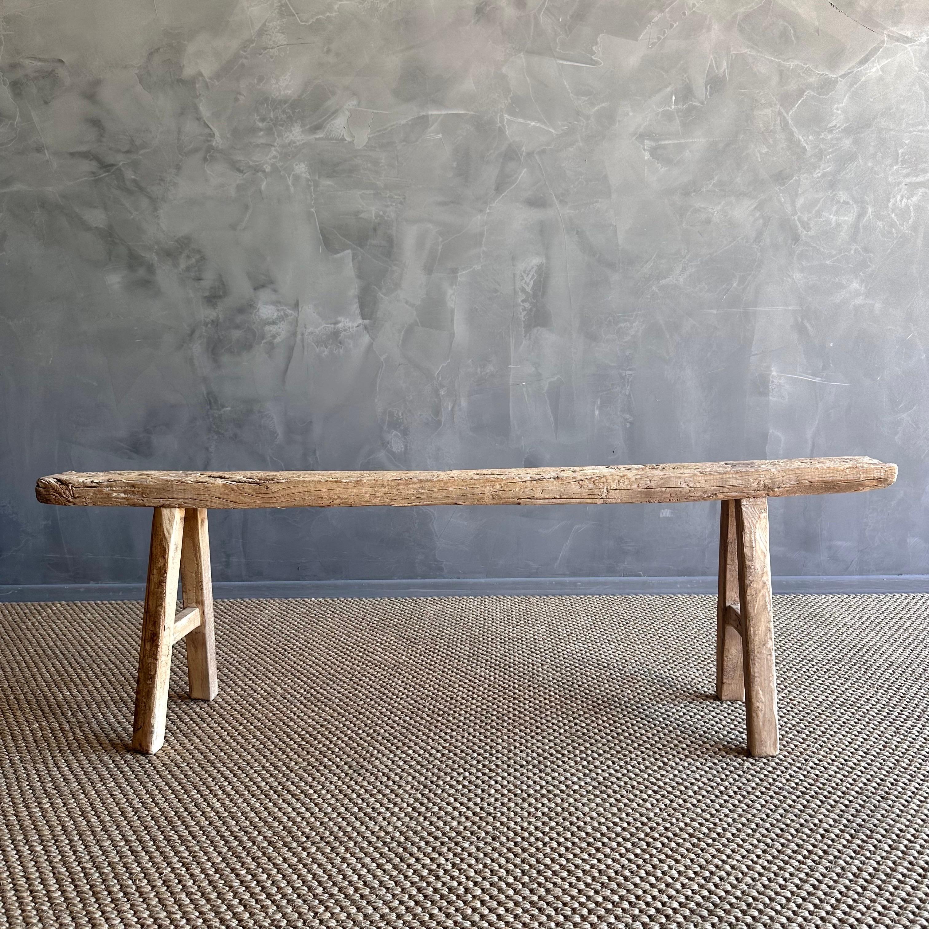 Vintage elm skinny bench.
Crafted from reclaimed elm wood, this bench is not only solid and sturdy but also exudes a charming rustic charm. Perfect for adding character to any room, this bench is ideal for placing at the end of a bed, in the