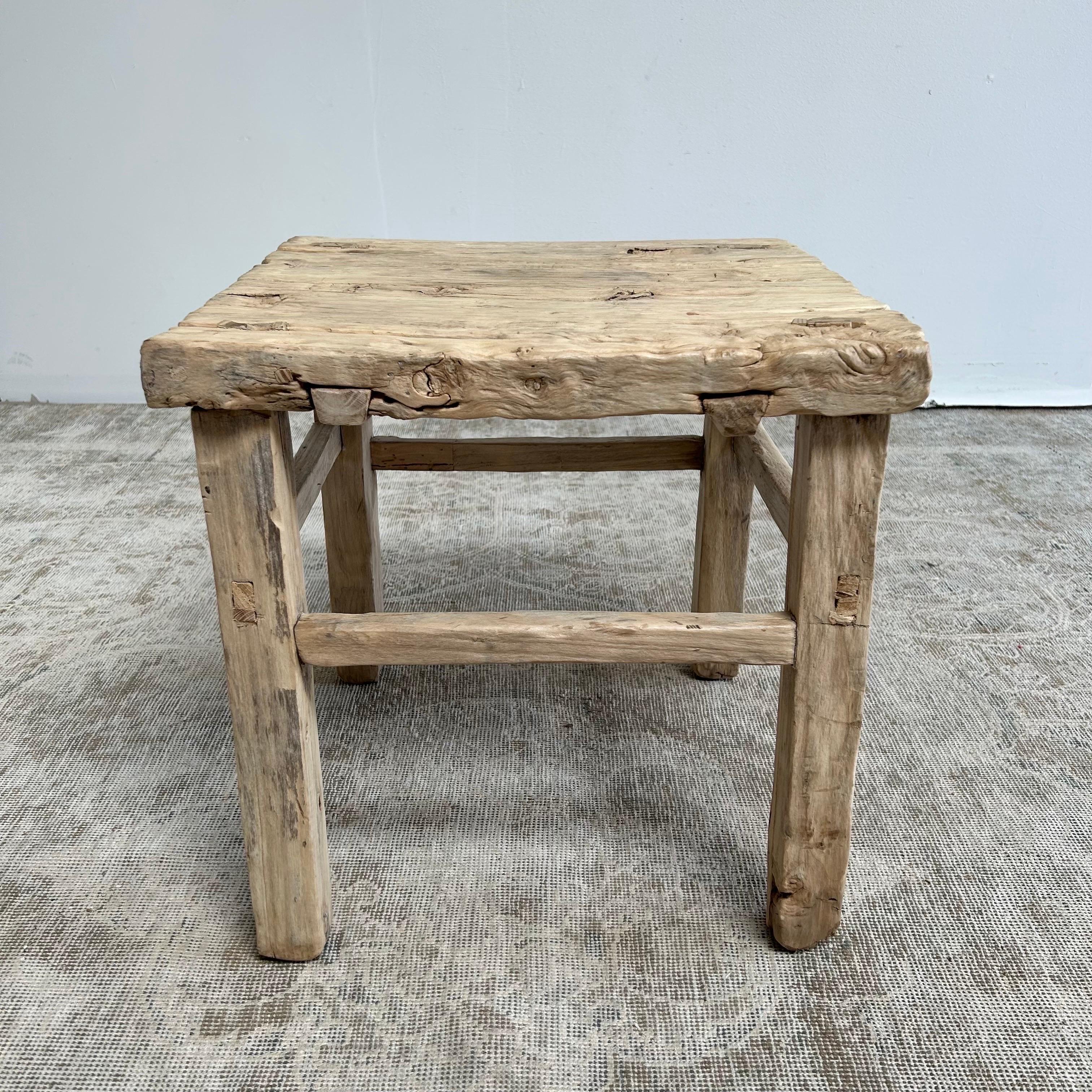 Wabi Sabi Style Elm side table 
Size; 18”w x 18”d x 18”h
Raw natural organic elm table is perfect next to a sofa, between a pair of chairs, or great to use as a stool.
Beautiful natural weathered patina, the table top has nice movement with the