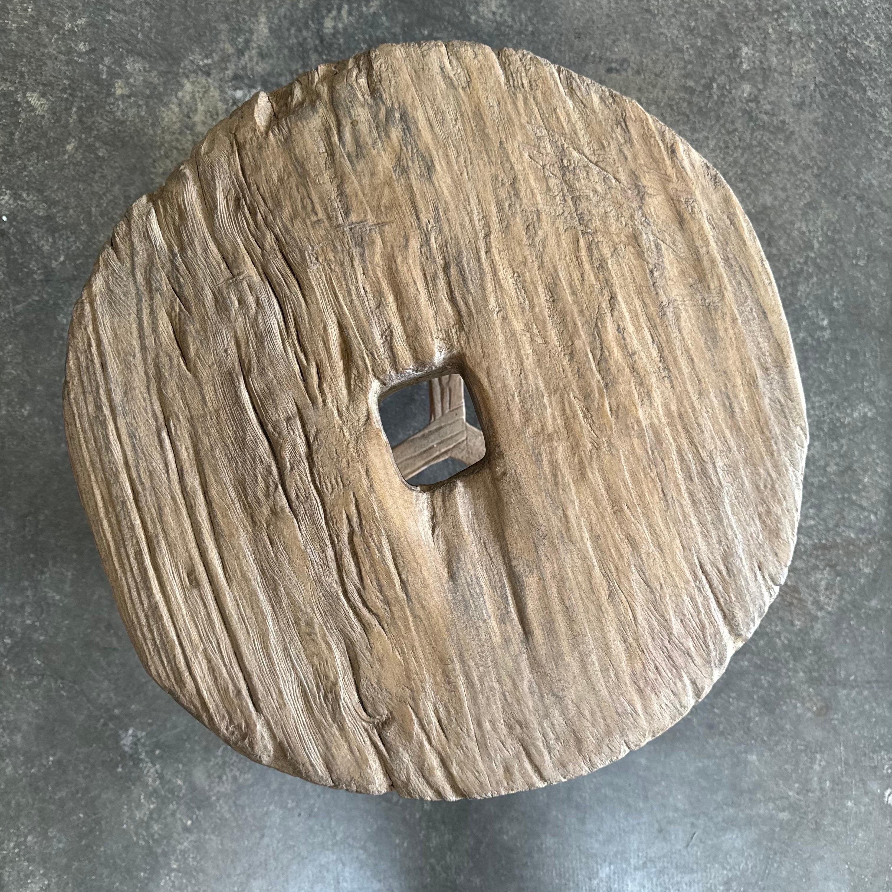 Organic Modern Vintage elm wood wheel side table For Sale