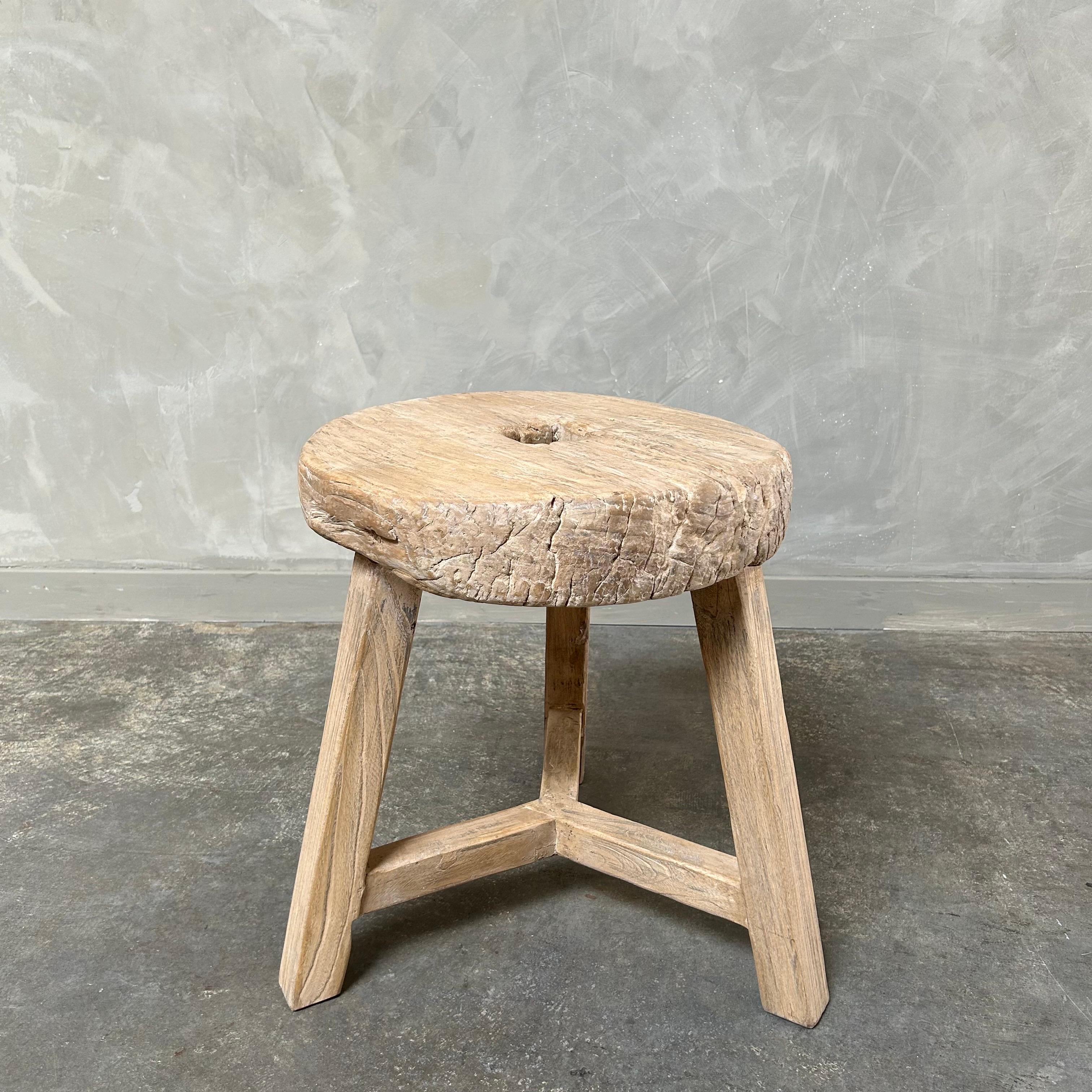 Antique wheel side table. This vintage elm wood wheel table is finished with medium to dark stain. The table is solid and sturdy ready for everyday use. Use as a side table, stool, powder room to add vintage style to your home. One of a kind