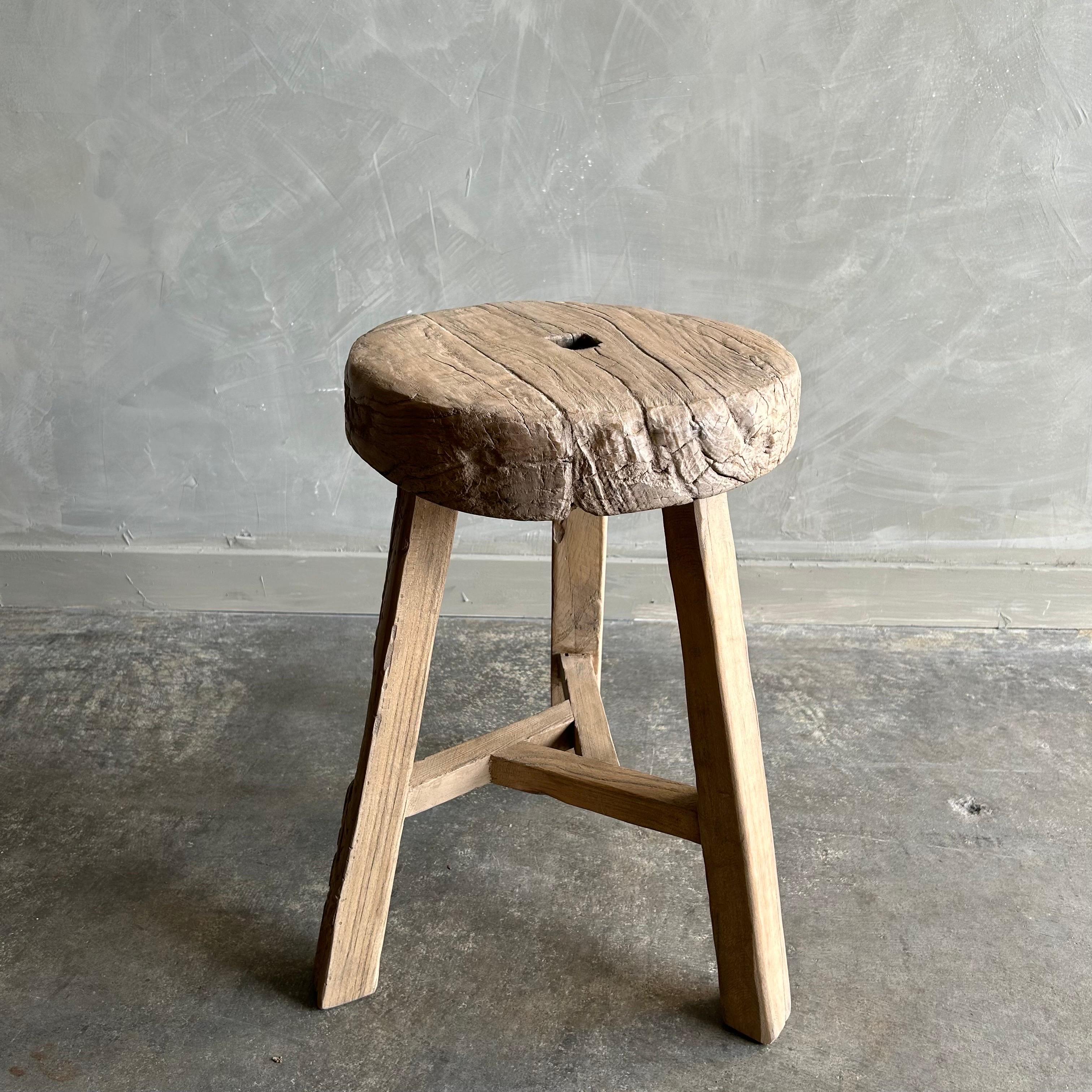 Vintage wheel side table. This vintage elm wood wheel table is finished with medium natural. The stool / table is solid and sturdy ready for everyday use. Use as a side table, stool, powder room to add vintage style to your home. One of a kind