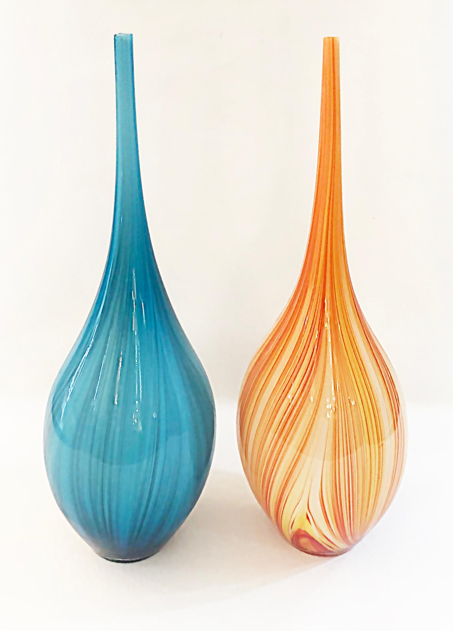 Vintage Elongated tall blown glass vases with Bulbous Bases in Blue and Amber

Offered for sale is a pair of elongated tall blown glass vases with bulbous bases. The vases are in blue and amber.