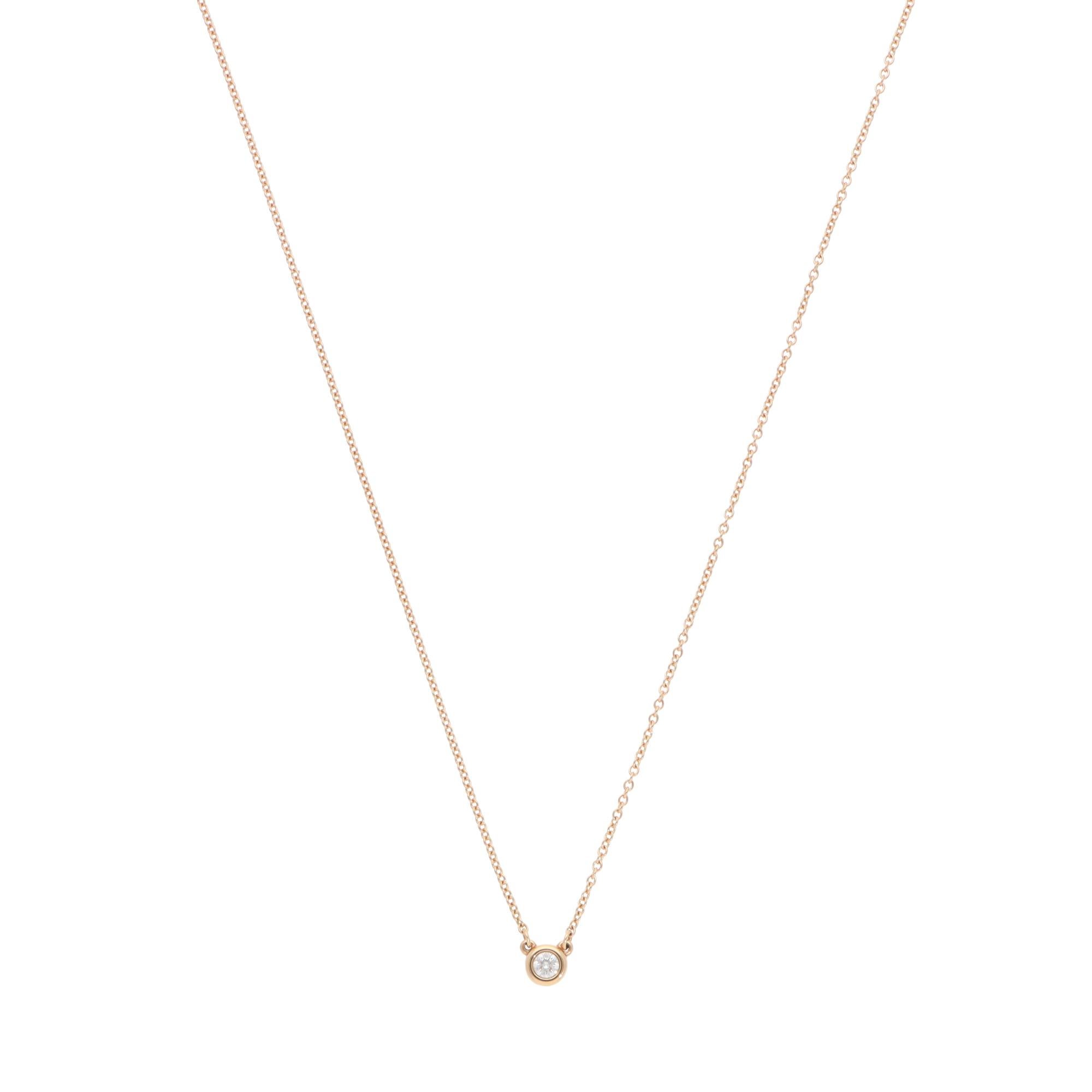 A classic vintage Elsa Peretti for Tiffany & Co. Diamonds by the Yard diamond solitaire necklace set in 18k rose gold.

From Tiffany's current Diamonds by the Yard collection, this dainty necklace has been crafted in exquisite rose gold, set with a