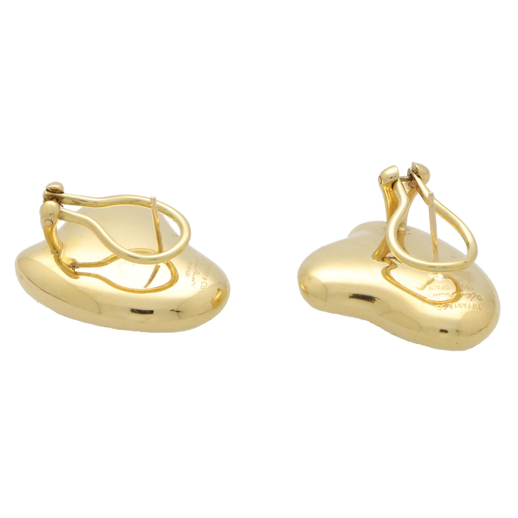 A beautiful vintage pair of Elsa Peretti for Tiffany & Co. full heart earrings set in 18k yellow gold.

Each earring is composed in the iconic Elsa Peretti full heart motif. The hearts are set in polished yellow gold which look fantastic once on the
