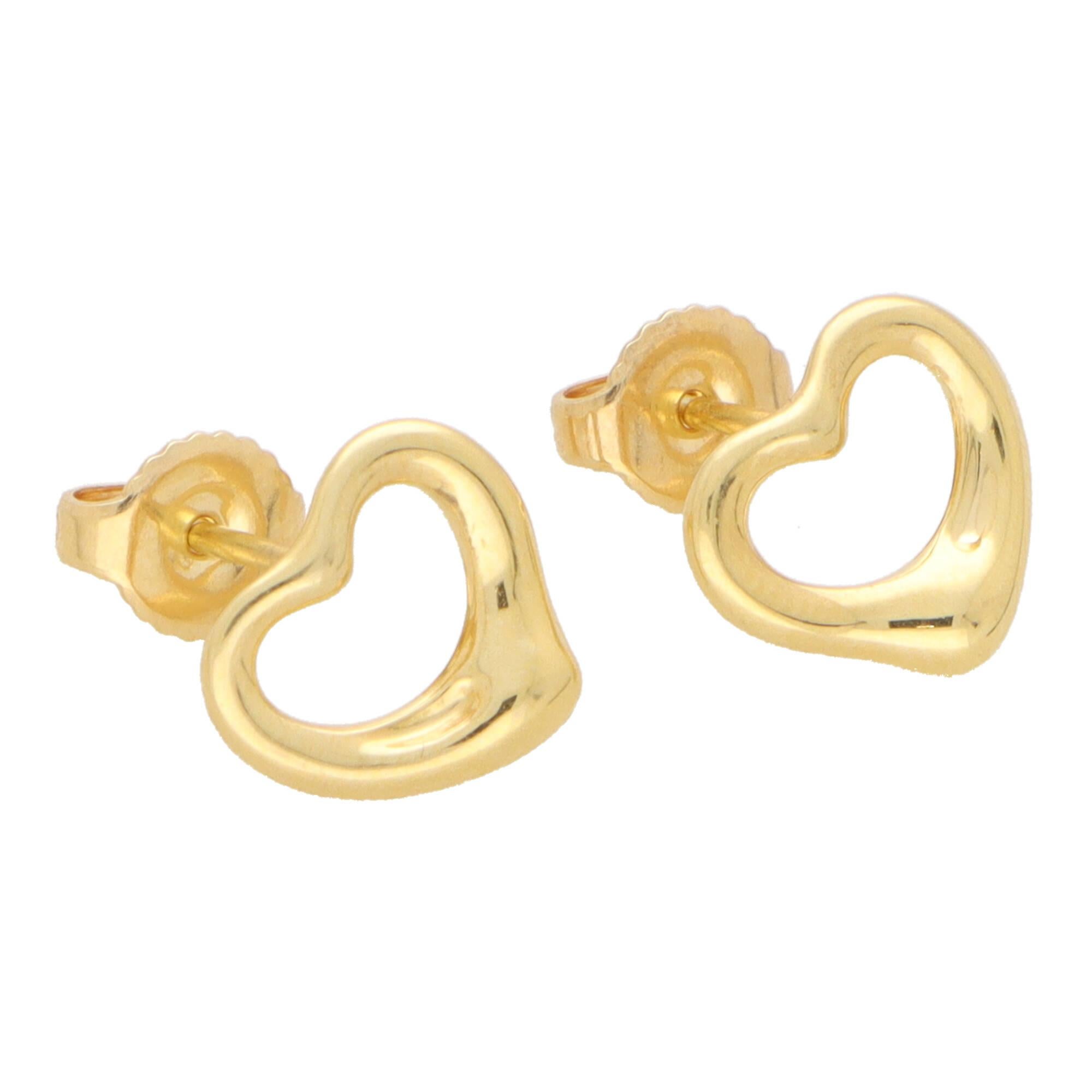 A lovely vintage pair of Elsa Peretti for Tiffany & Co. open heart stud earrings set in 18k yellow gold.

From the current Elsa Peretti collection; each earring is composed in the iconic open heart motif. The hearts are set in polished yellow gold