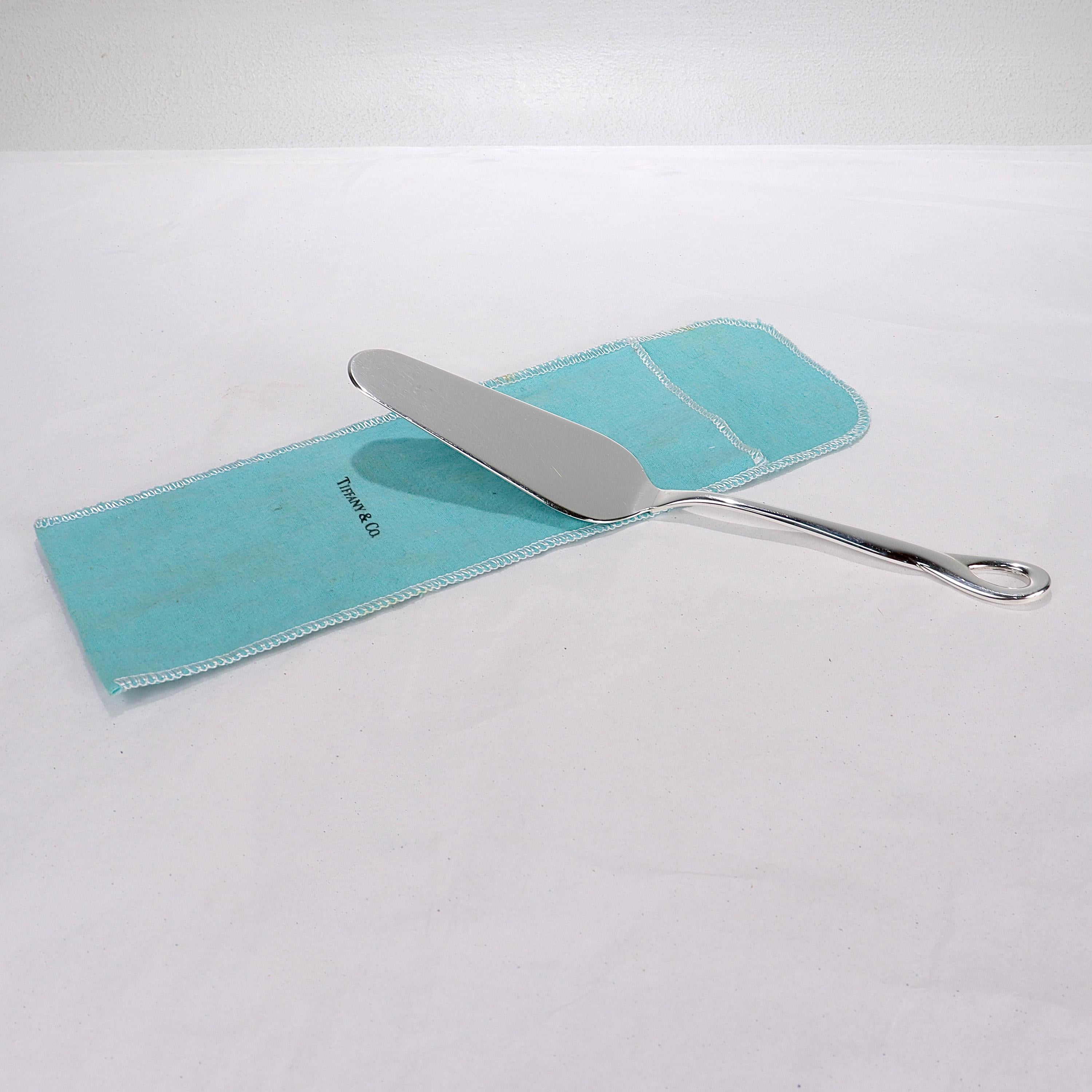 A fine Padova pie or cake server.

In sterling silver.

Designed by Elsa Peretti for Tiffany & Co.

Marked to the reverse for 1984.

Together with its original Tiffany pouch.

Simply a wonderful iconic server!

Date:
1984

Overall Condition:
It is