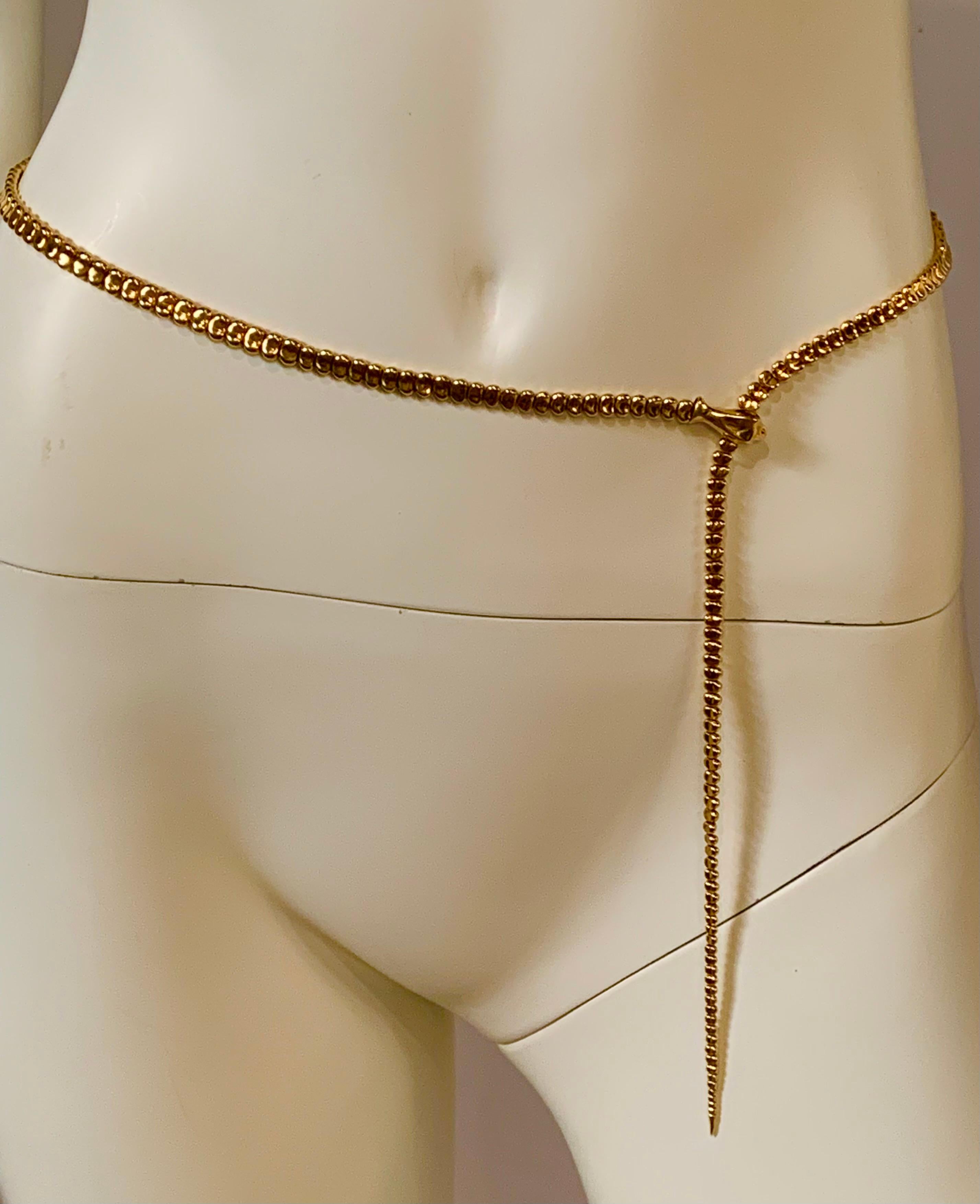 A very rare and striking 18 karat gold snake makes the perfect belt or necklace. The belt was designed by Elsa Peretti in the early 1970's in sterling silver, and then in gold to accessorize the designs of Halston. It was retailed by Tiffany & Co.