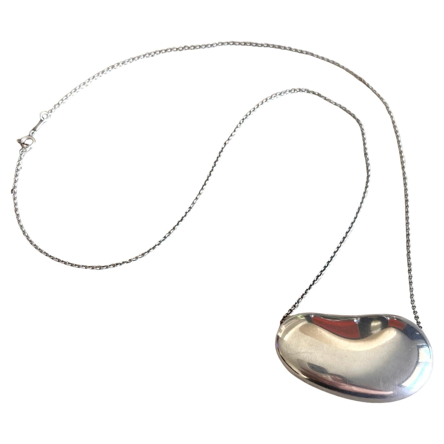 Vintage 1970's sterling silver bean necklace designed by Elsa Peretti for Tiffany & Co.  Bean measures 2