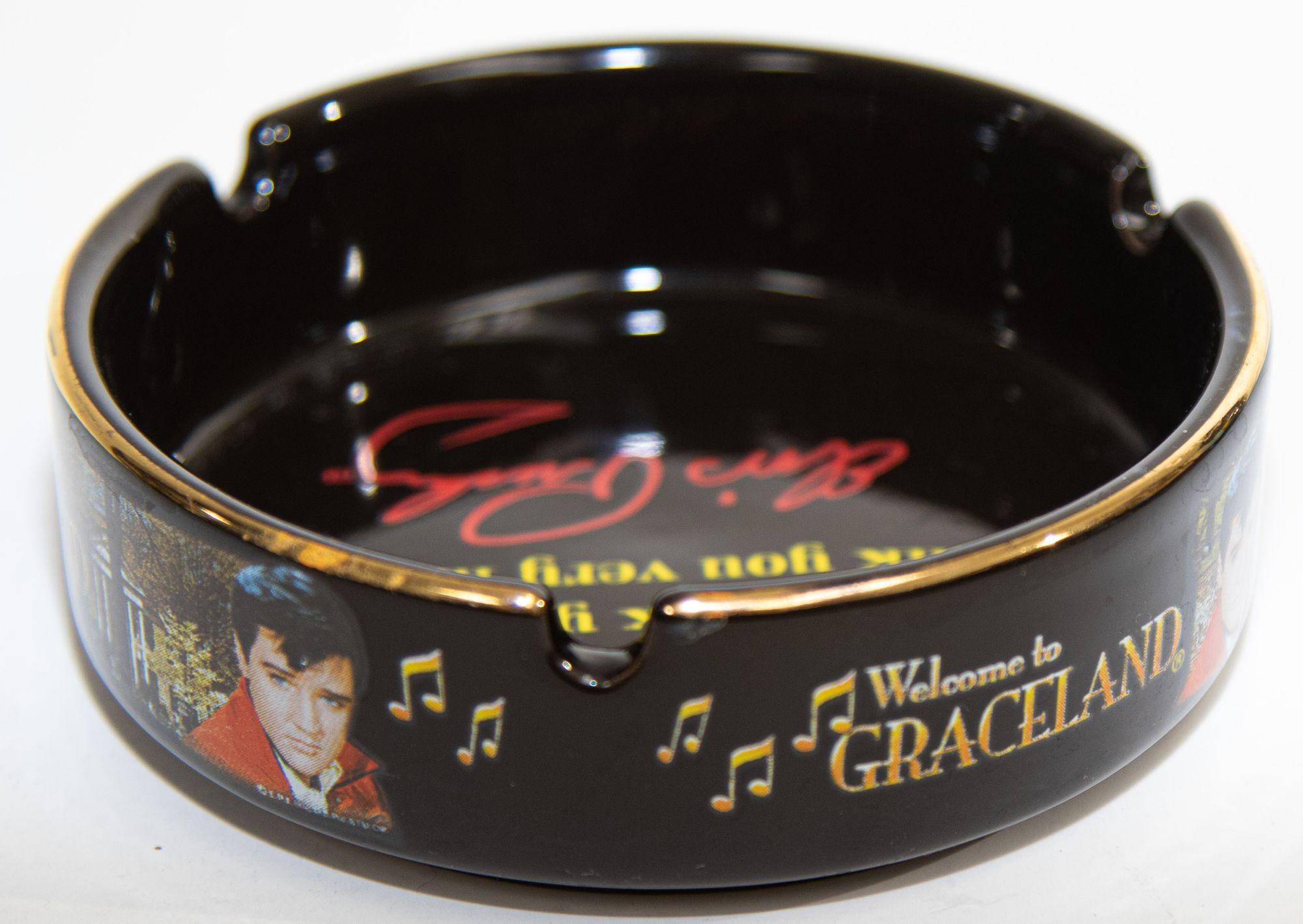 Vintage Elvis Presley Graceland Black Porcelain Ashtray.
Collectible souvenir Elvis Presley Graceland Ash Tray gold trim.
Excellent preowned condition.
From Elvis Presley Memphis, Graceland Museum.
Inscribed as below in yellow and signed in red.
