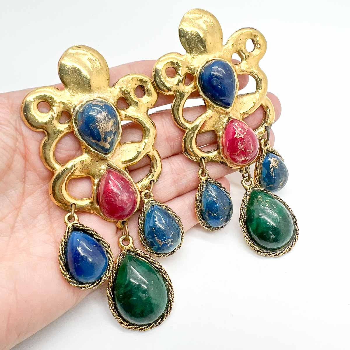 An ultra rare pair of Vintage Ungaro Statement Cabochon Earrings. Grandeur and craftmanship combine to perfection in these one-of-a-kind hand-made earrings. Brushed gold plated metal is set with large, opulent teardrop shaped cabochon glass